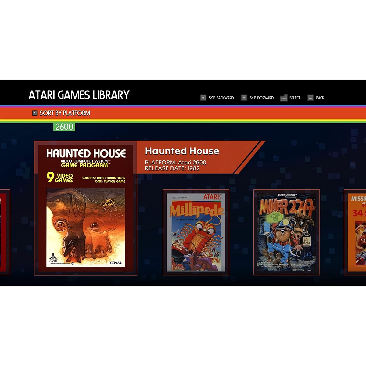 Ekran biblioteki gier Atari, z grafiką pudełka gry 'Haunted House' i innymi widocznymi tytułami gier.