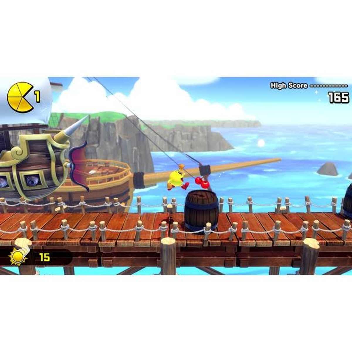 Pac-Man łowi ryby z drewnianego molo. Najwyższy wynik na górze. Statek piracki i morze w tle.
