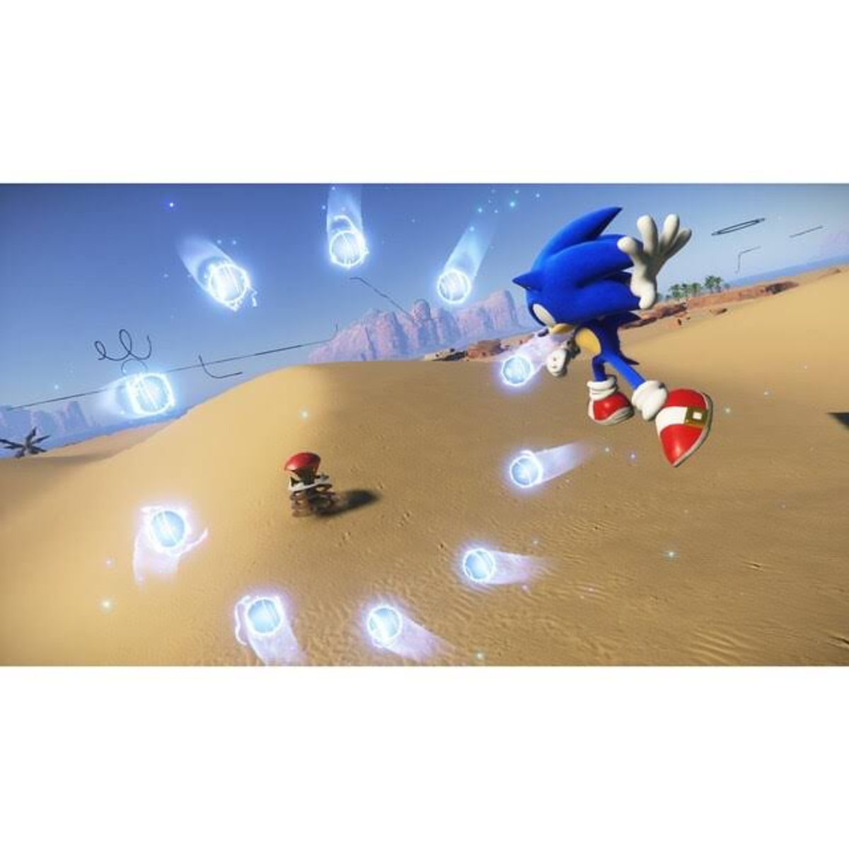 Sonic the Hedgehog biegnie po pustyni. Niebieskie smugi prędkości i mały robot w scenie.