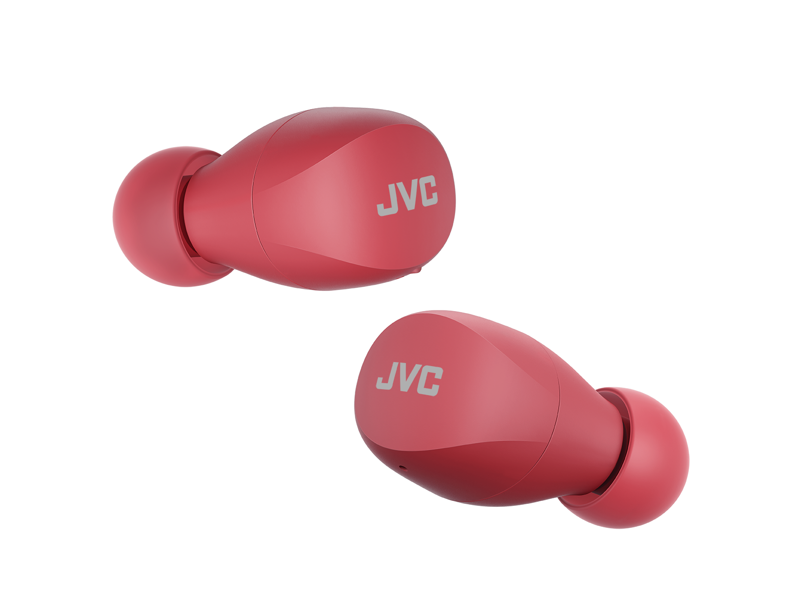 Czerwone słuchawki JVC, dwa na zdjęciu. Czarne tło, widok z bliska.