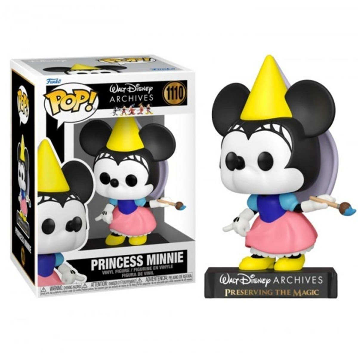 Statuetta di Minnie Principessa in una scatola. Indossa un cappello giallo, un vestito rosa e tiene un pennello.