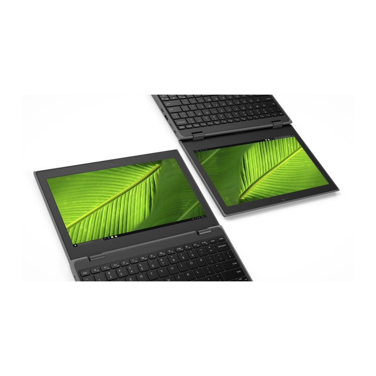 Dwa czarne laptopy z tapetą z zielonymi liśćmi na ekranach, białe tło.