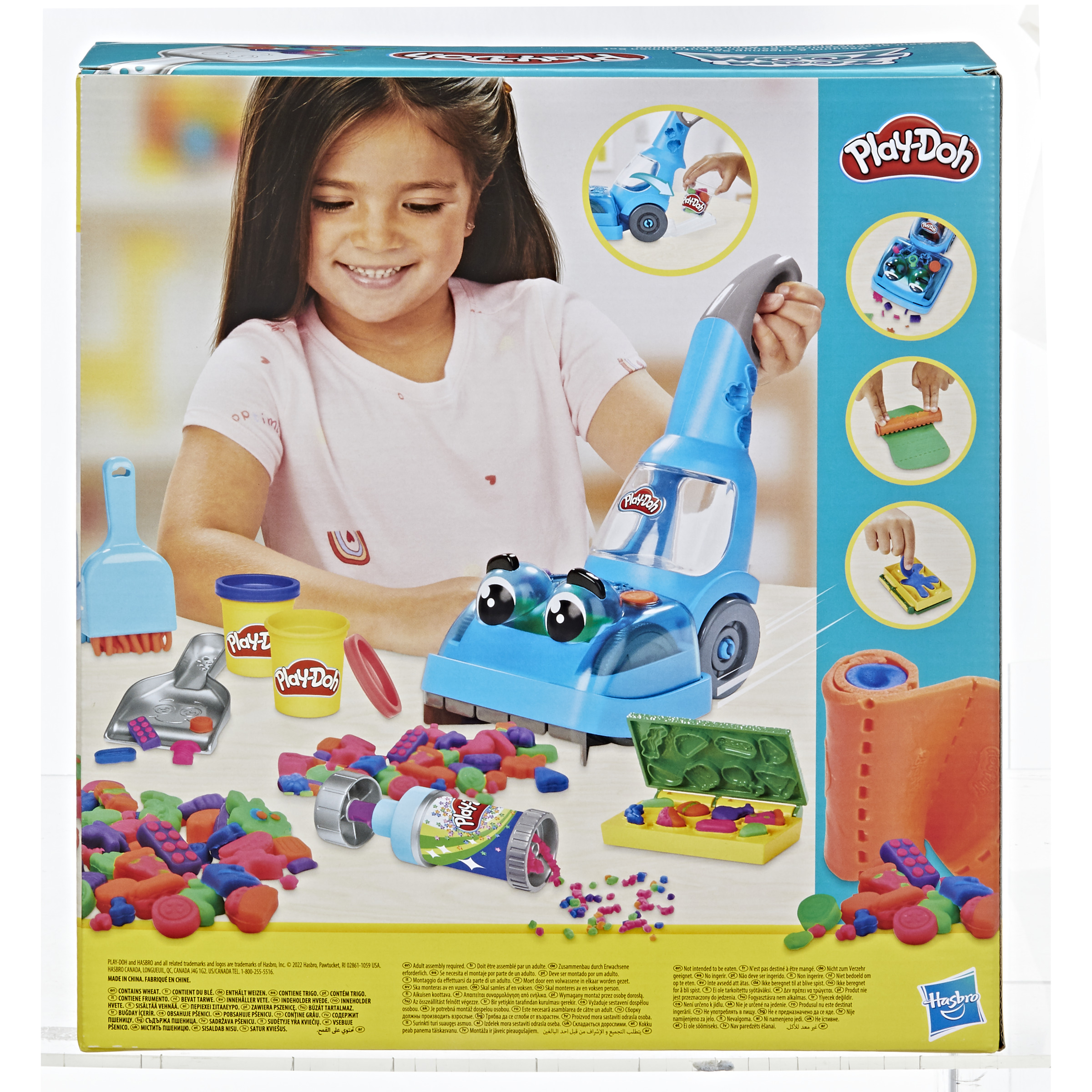 Una caja de Play-Doh muestra a una niña sonriendo. Se exhiben juguetes, incluido un aspirador.