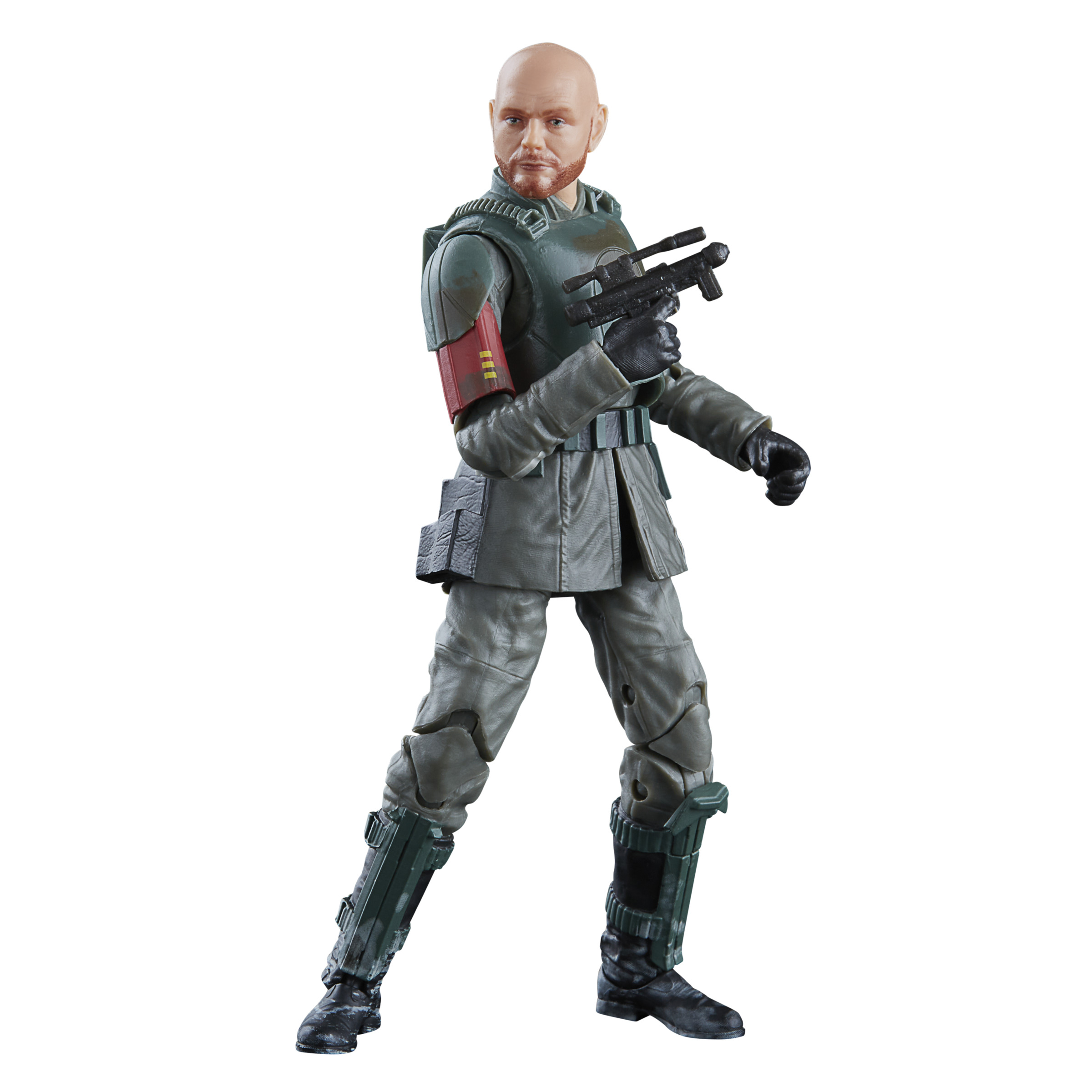 Action figure di un uomo calvo che tiene una pistola. Indossa un abito verde.