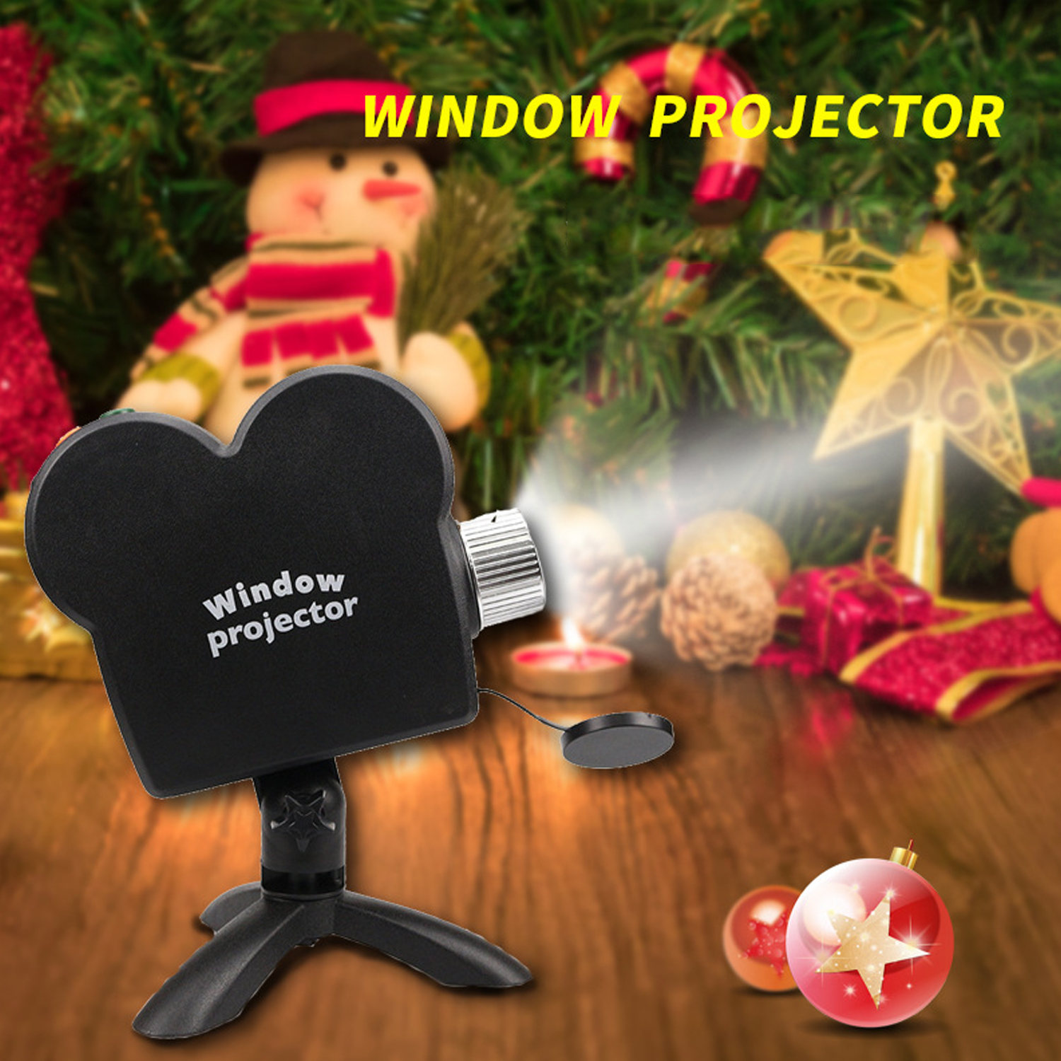 Proyector de ventana negro sobre trípode; decoración navideña con muñeco de nieve y adornos.