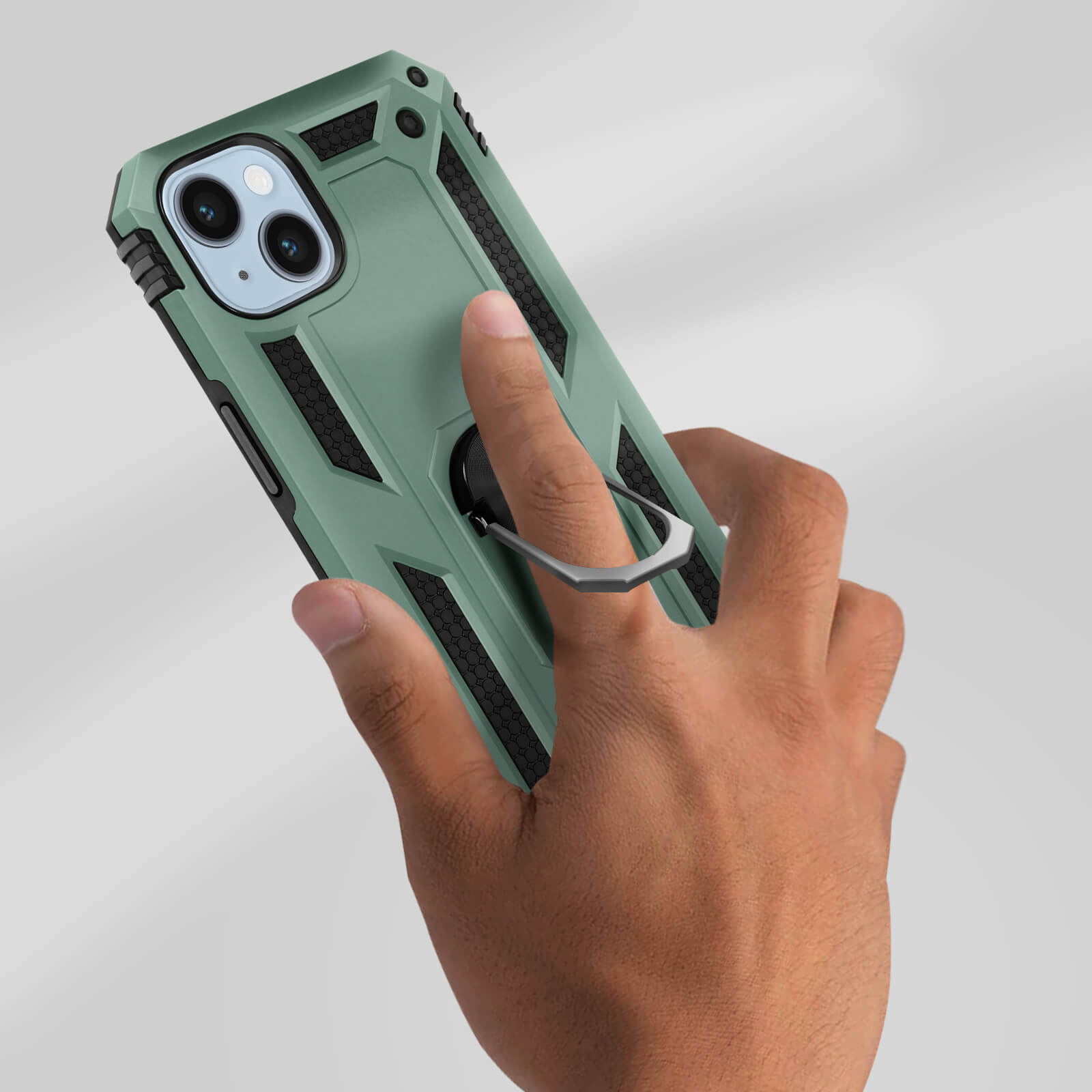 Custodia per telefono verde. Una mano tiene la custodia. C'è un anello sul retro.
