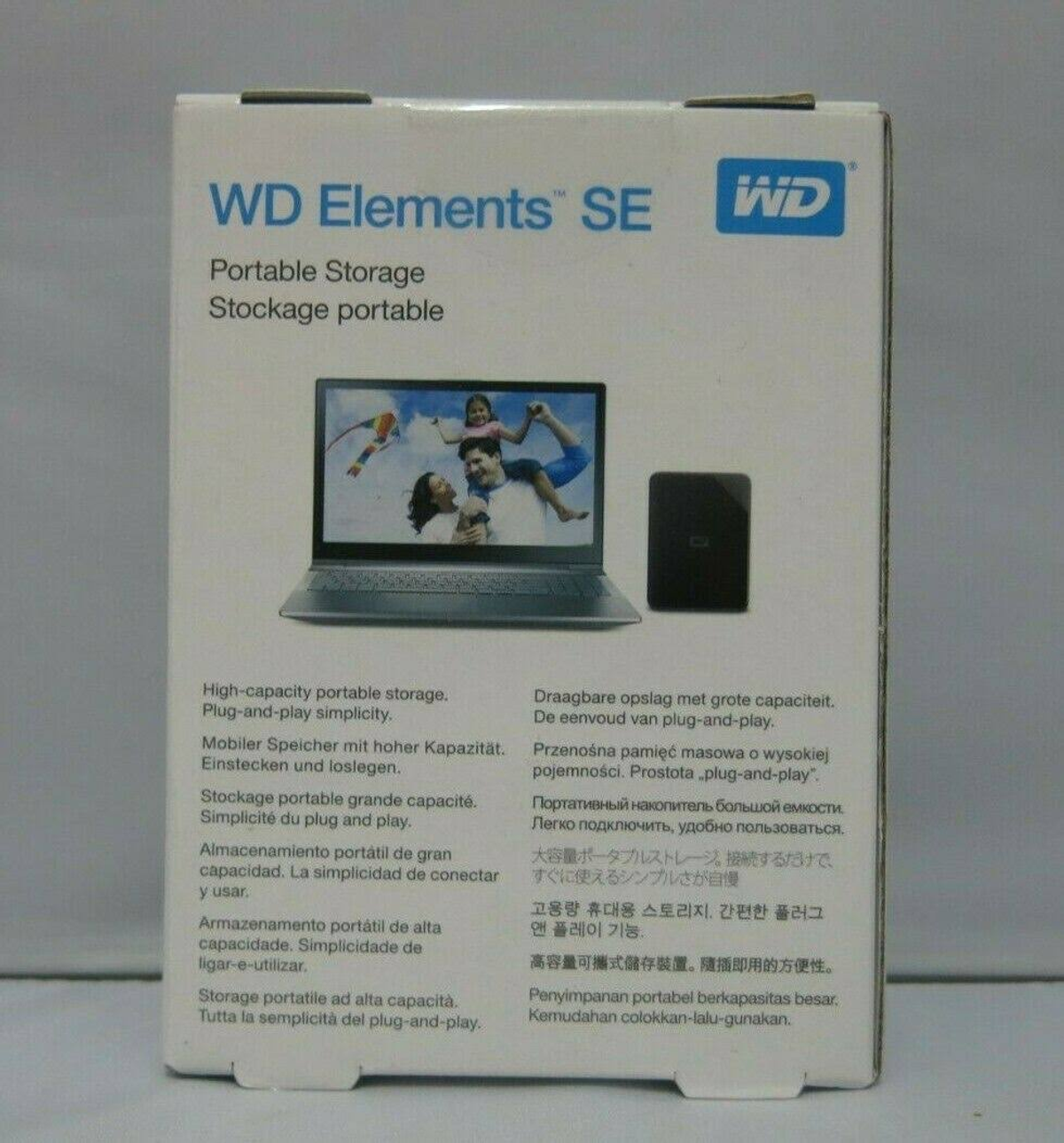 Biało-niebieskie pudełko z przenośną pamięcią WD Elements SE. Pudełko przedstawia laptop i dysk.