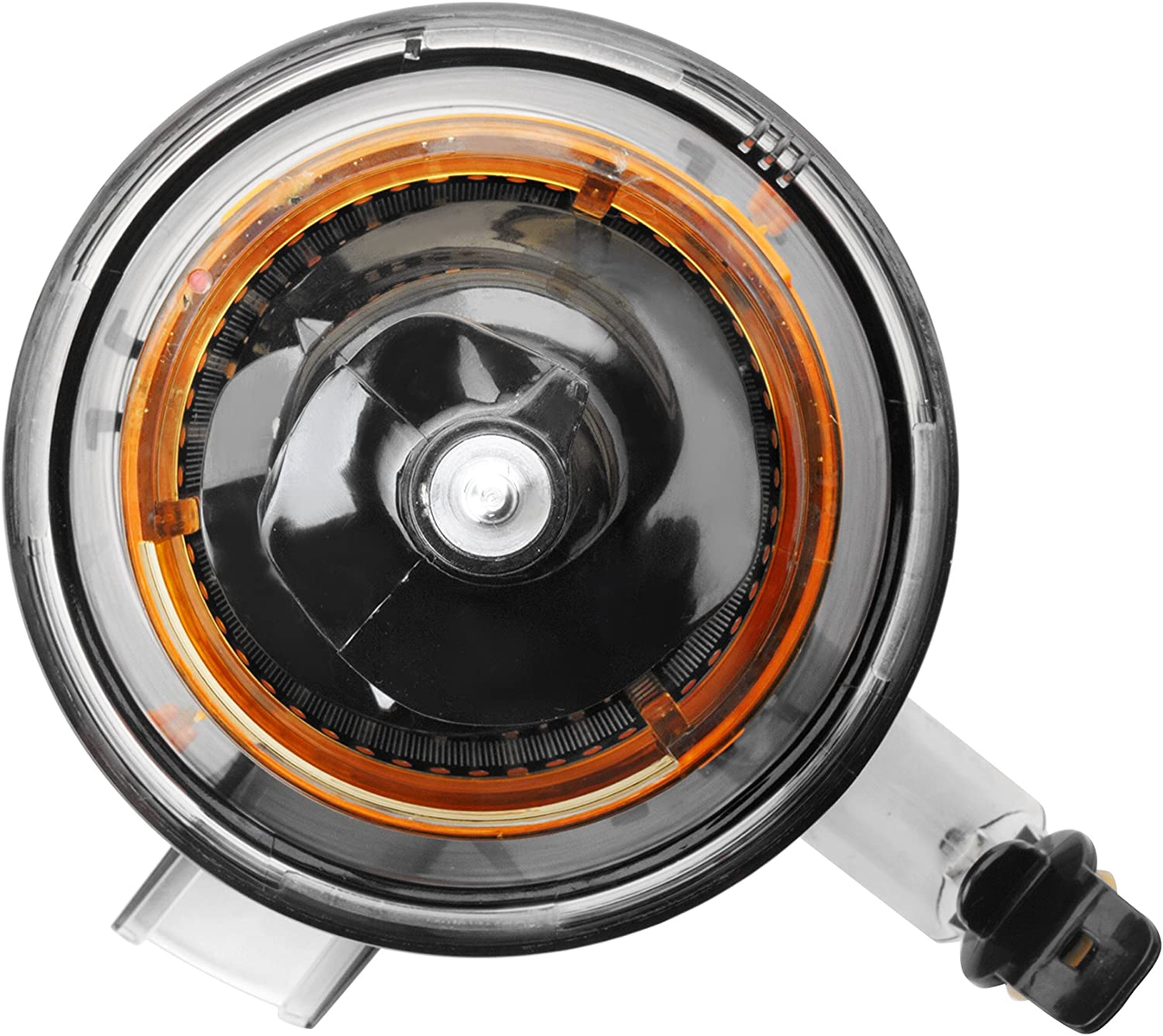 Primer plano de un faro de coche. La luz es negra y naranja con una cubierta transparente.