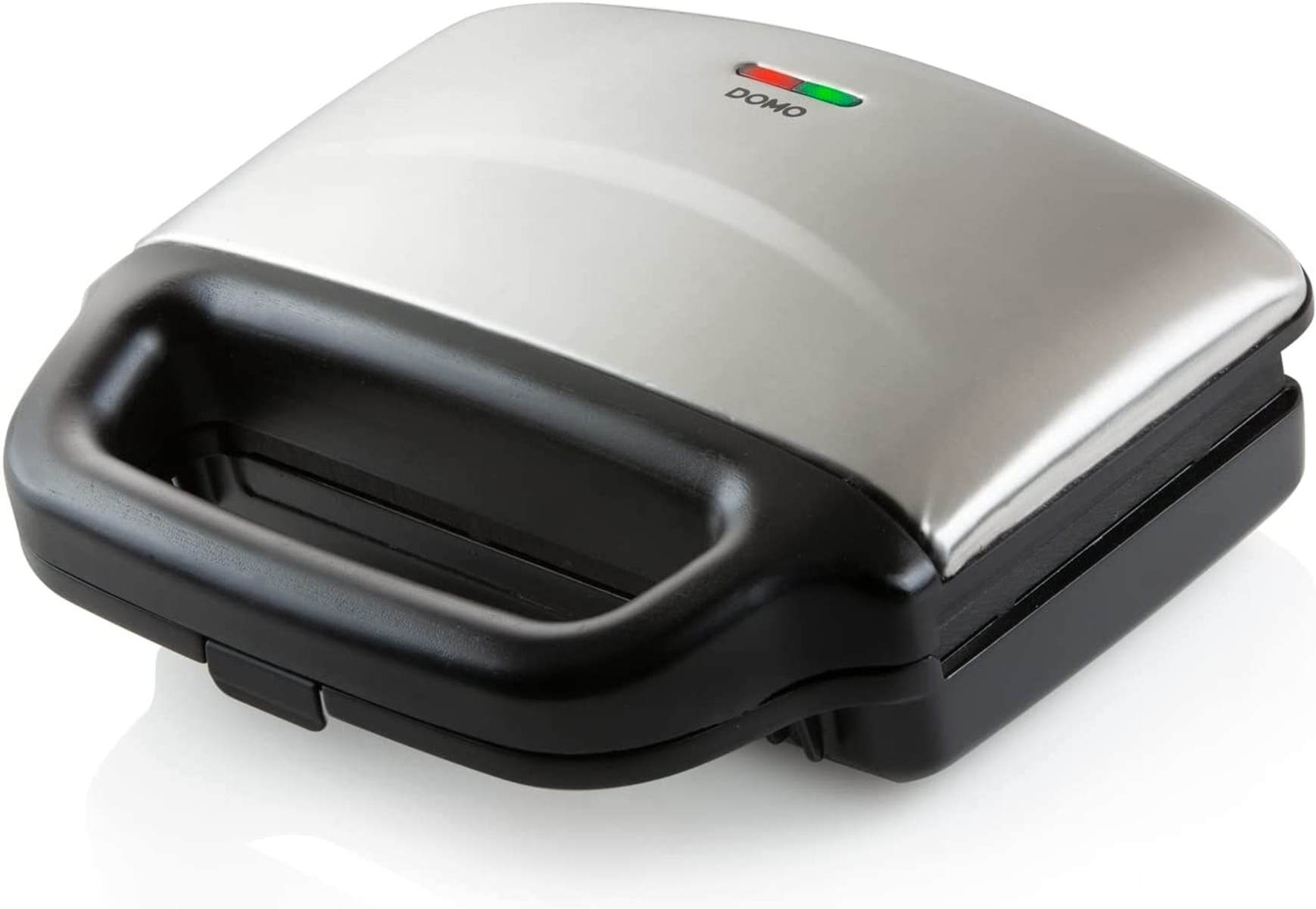 Zamknięty opiekacz do kanapek z czarną podstawą i srebrną górą. Świecą się zielone i czerwone światła.