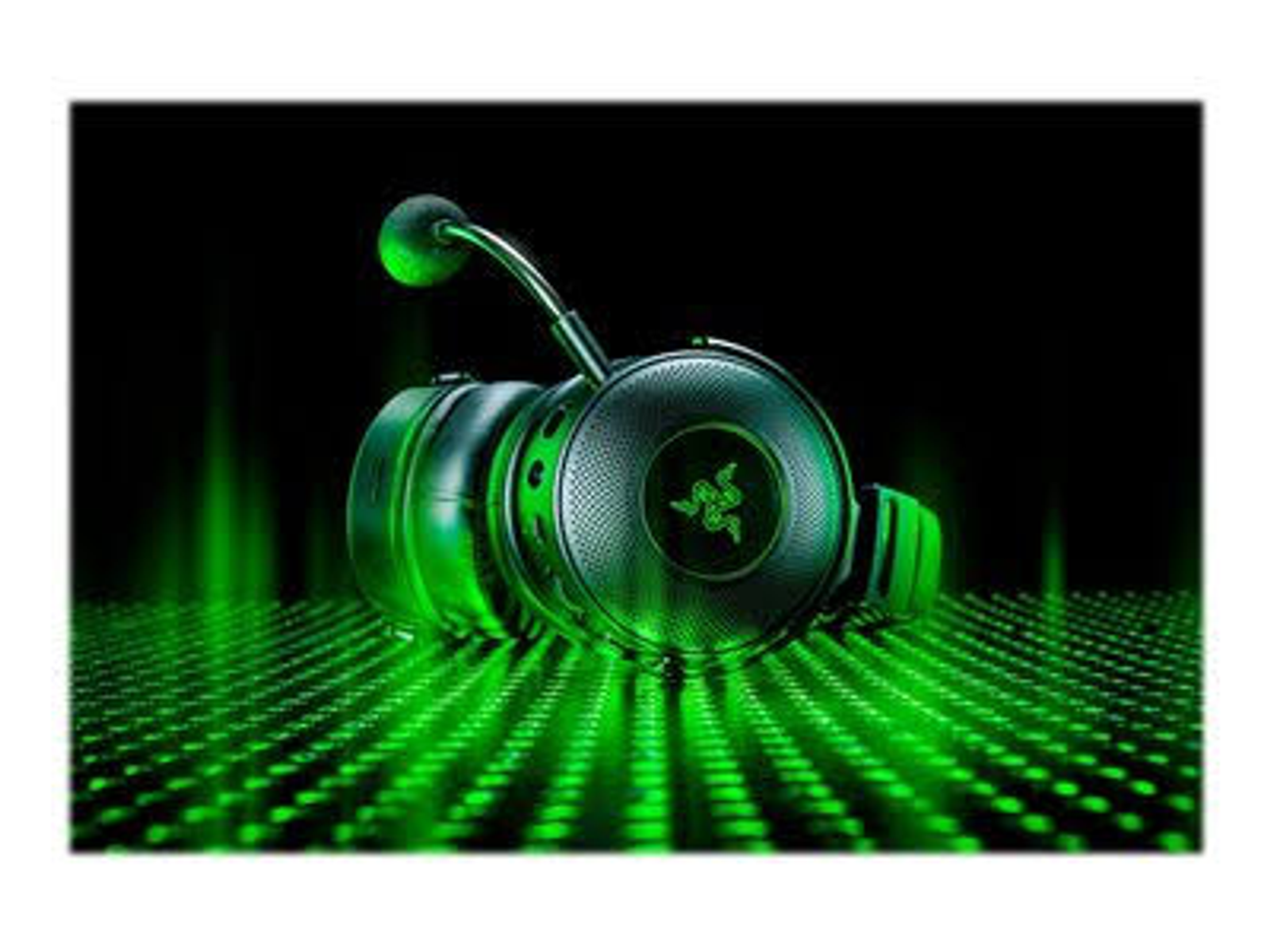 Green and black Razer gaming headphones with a microphone, on a green illuminated surface.