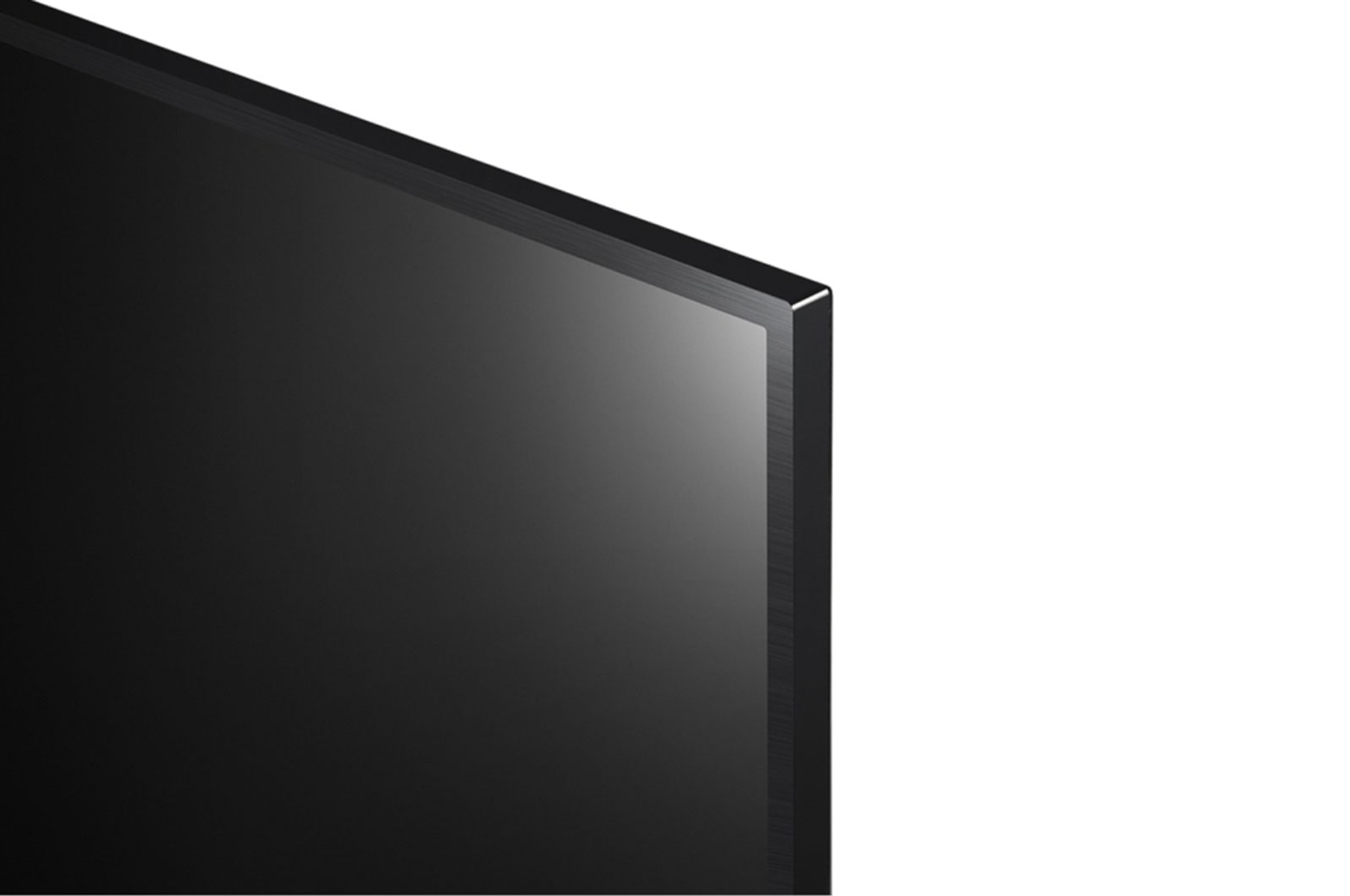 Esquina de TV negra. Pantalla negra con ligera reflexión. Fondo blanco. Muestra el borde de la pantalla.