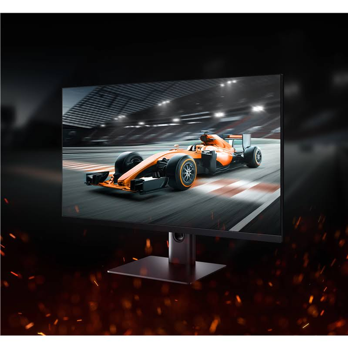 Monitor wyświetla pomarańczowy samochód wyścigowy na torze. Ekran jest czarny i ma podstawkę.