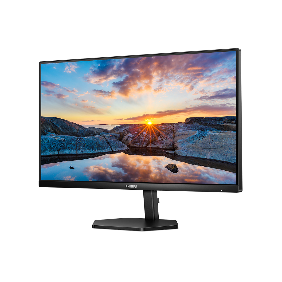 Un monitor con una scena di tramonto sul display, che mostra una costa rocciosa e acqua.