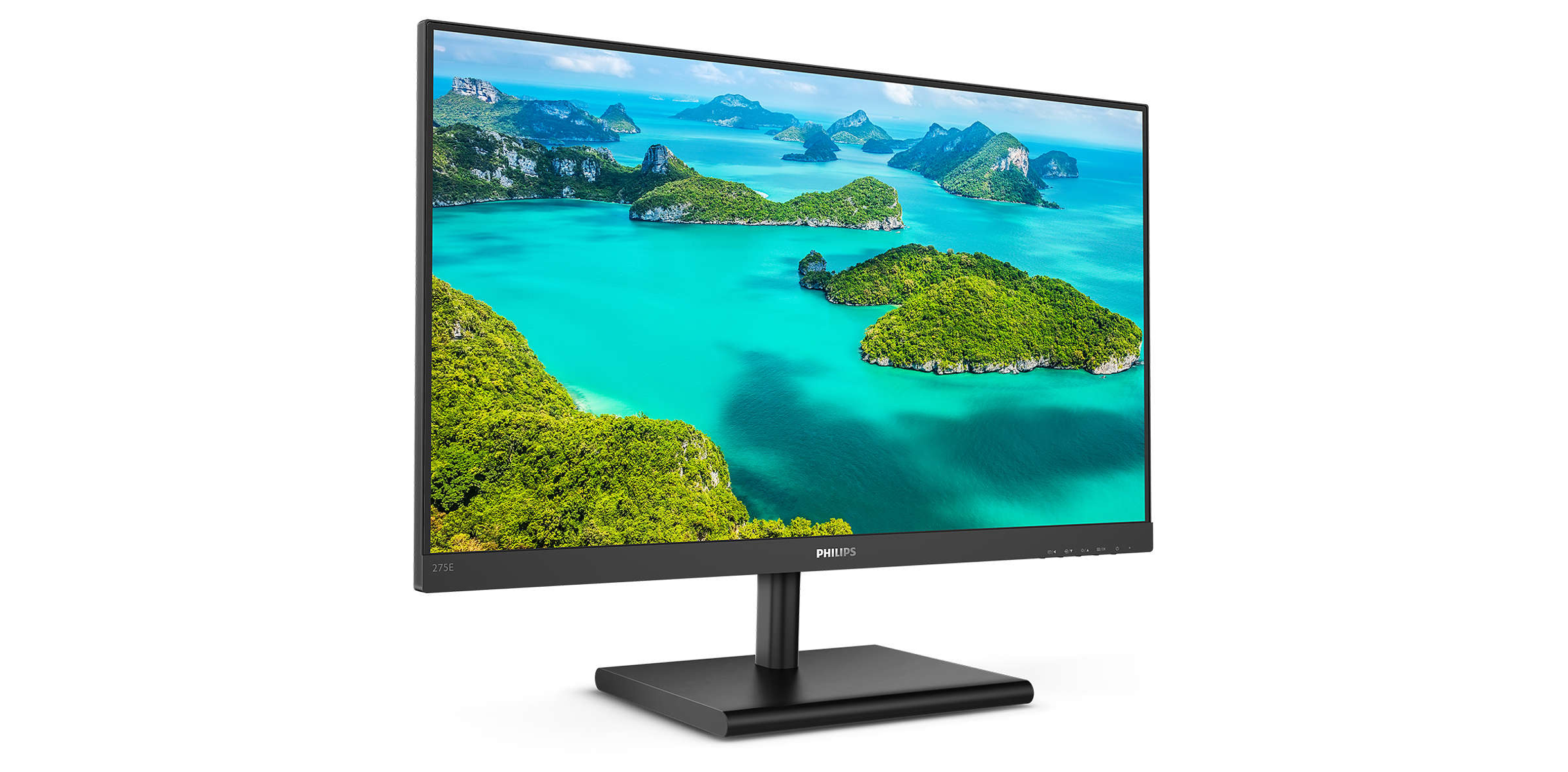 Un monitor de computadora que muestra un paisaje de isla con árboles verdes y agua azul.