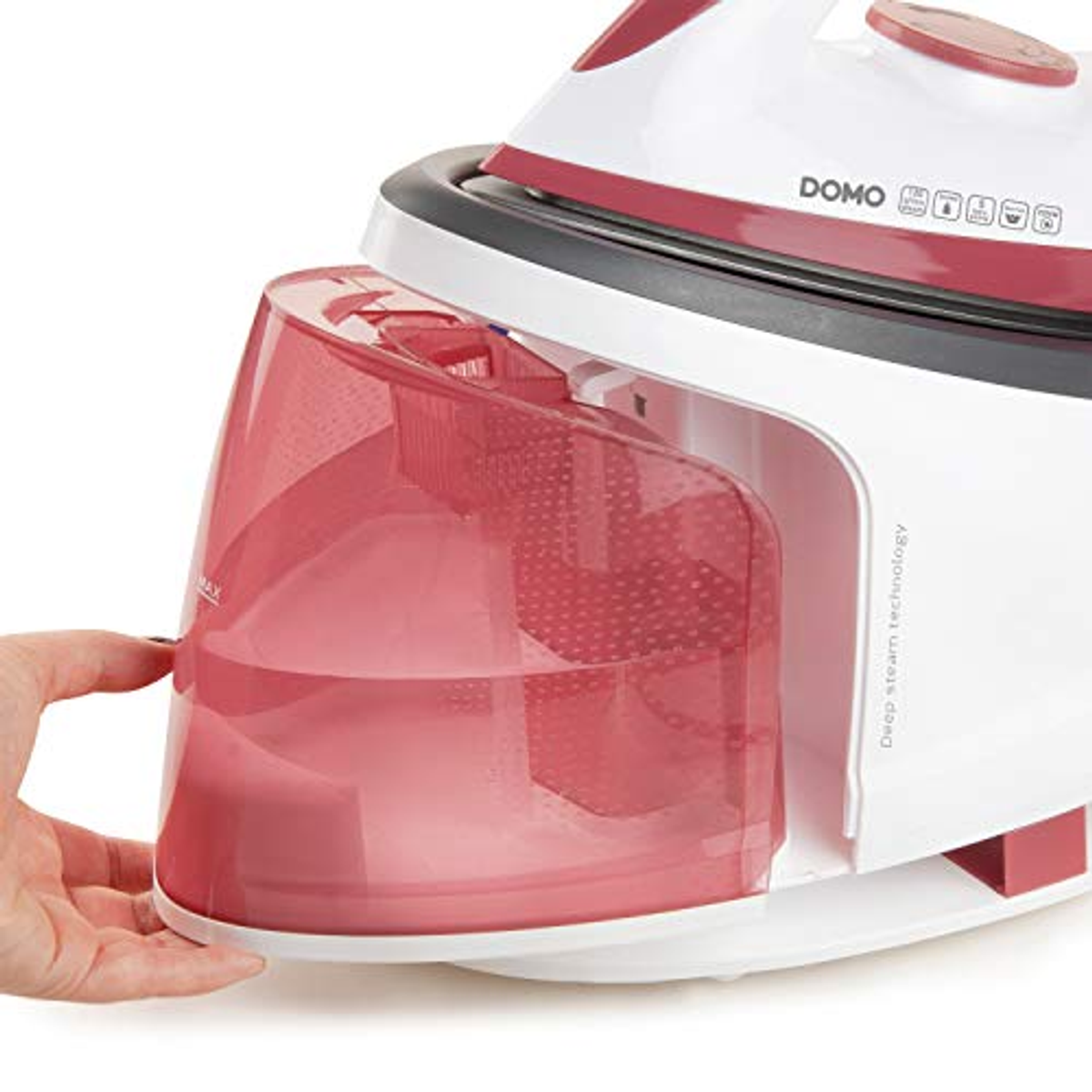 A close-up of a white and red iron with a pink water tank.
