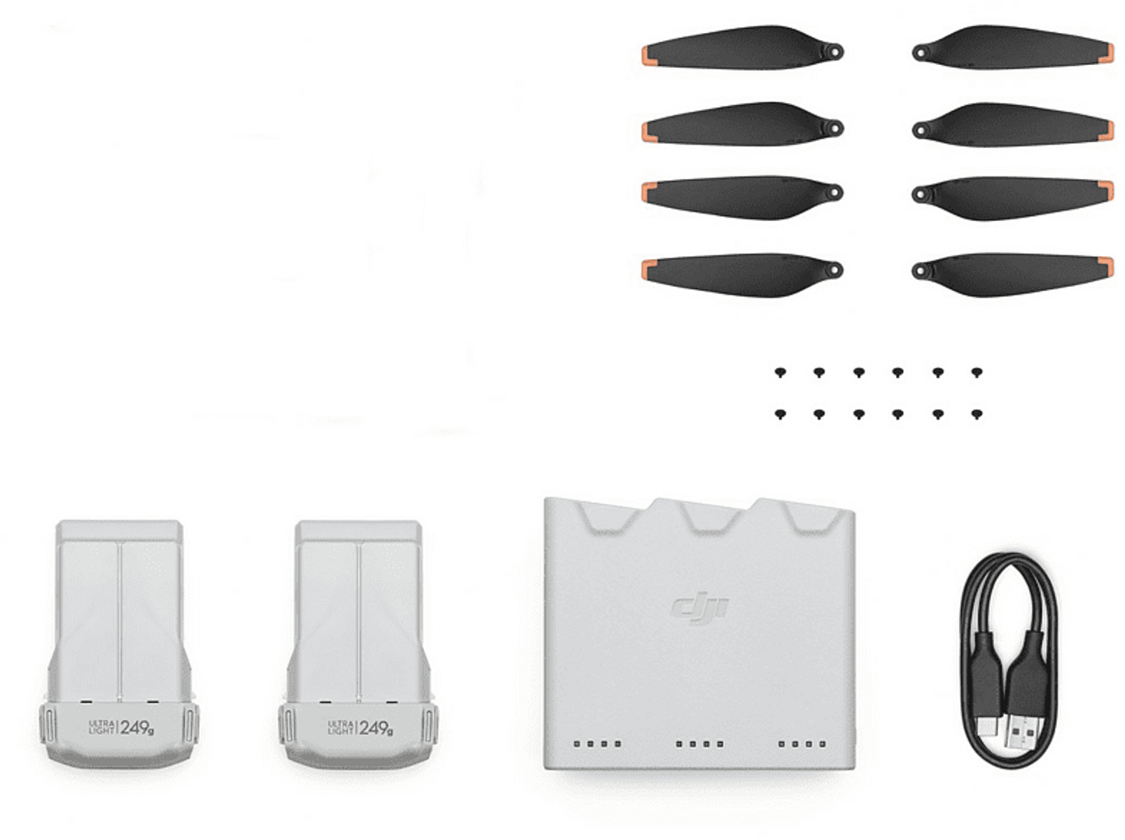 Drohnenzubehör: Propeller, Batterien, Ladegerät und Ladekabel.