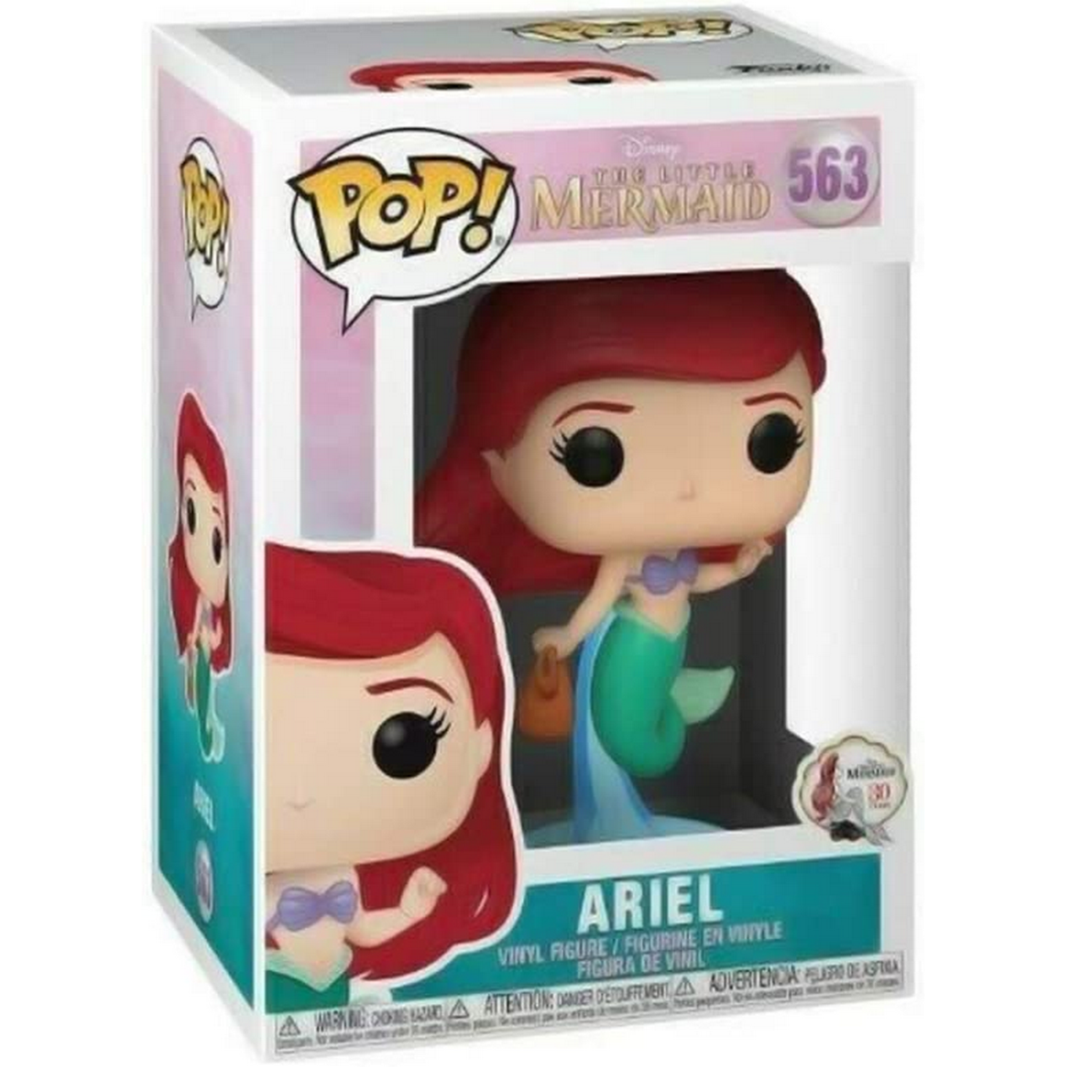 Figurina di Ariel in una scatola. Tema La Sirenetta. La statuetta ha i capelli rossi.