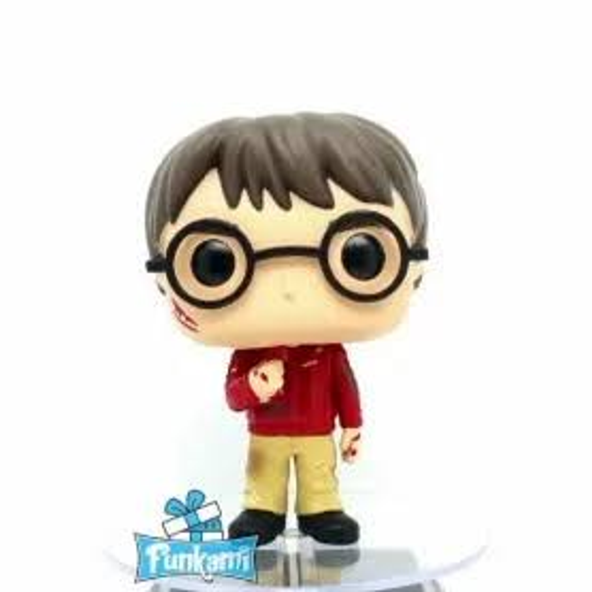 Figura Funko Pop di Harry Potter con occhiali e cicatrice, maglione rosso.