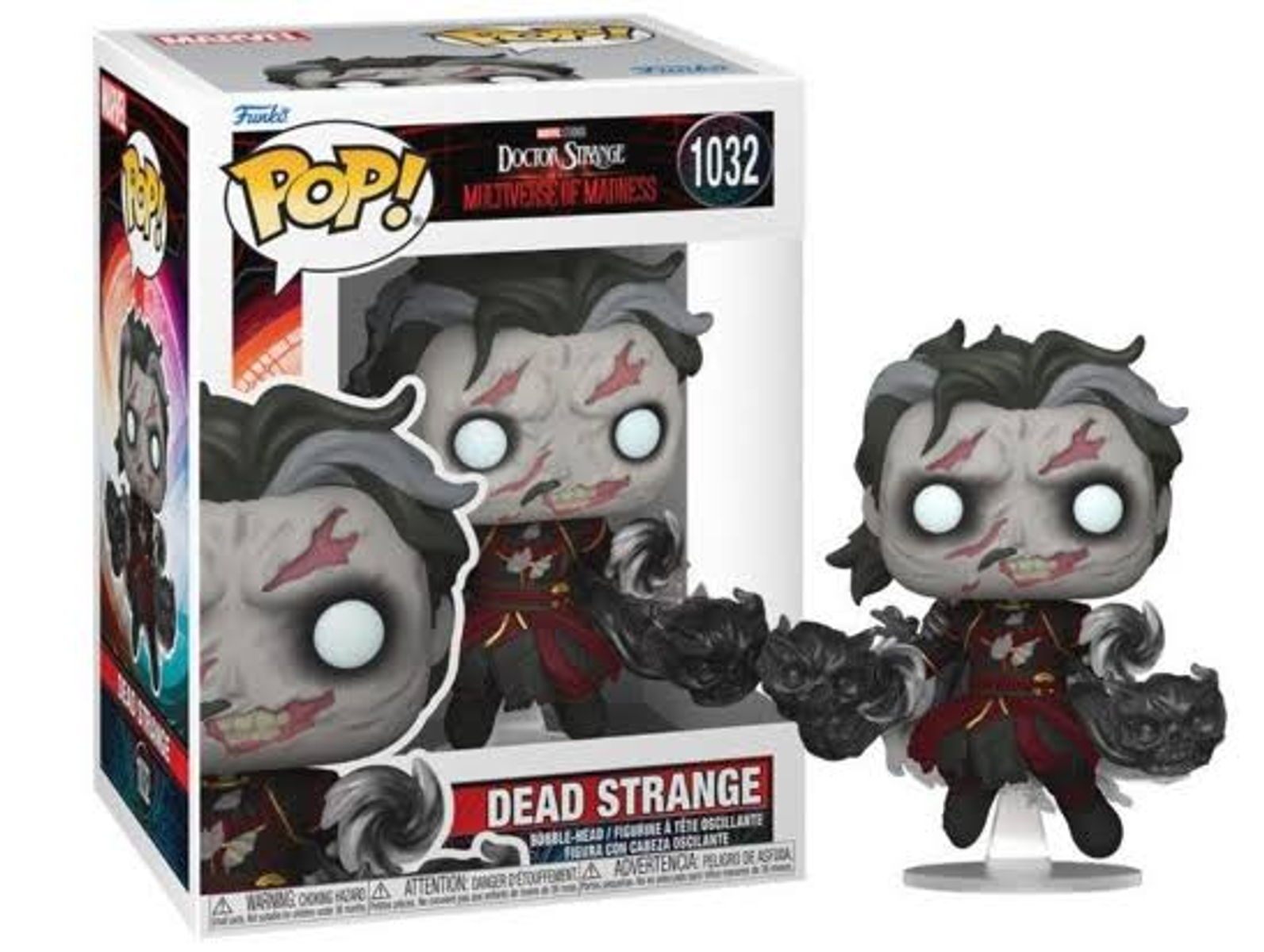 Figura Funko Pop di Dead Strange in scatola. La figura è grigia con abiti rossi e tiene due oggetti neri.
