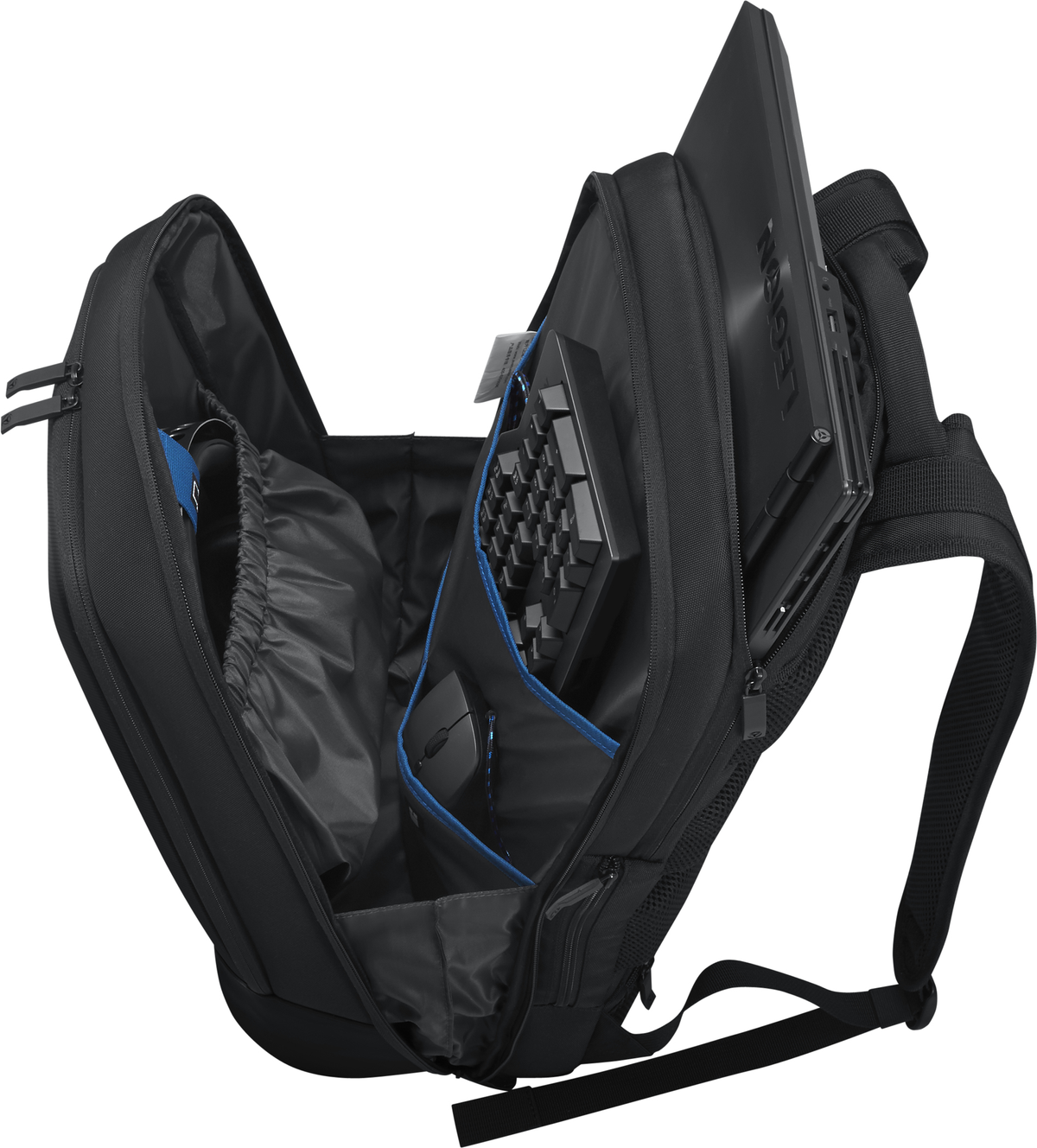 Mochila negra abierta. Portátil, teclado, ratón y otros objetos visibles dentro.