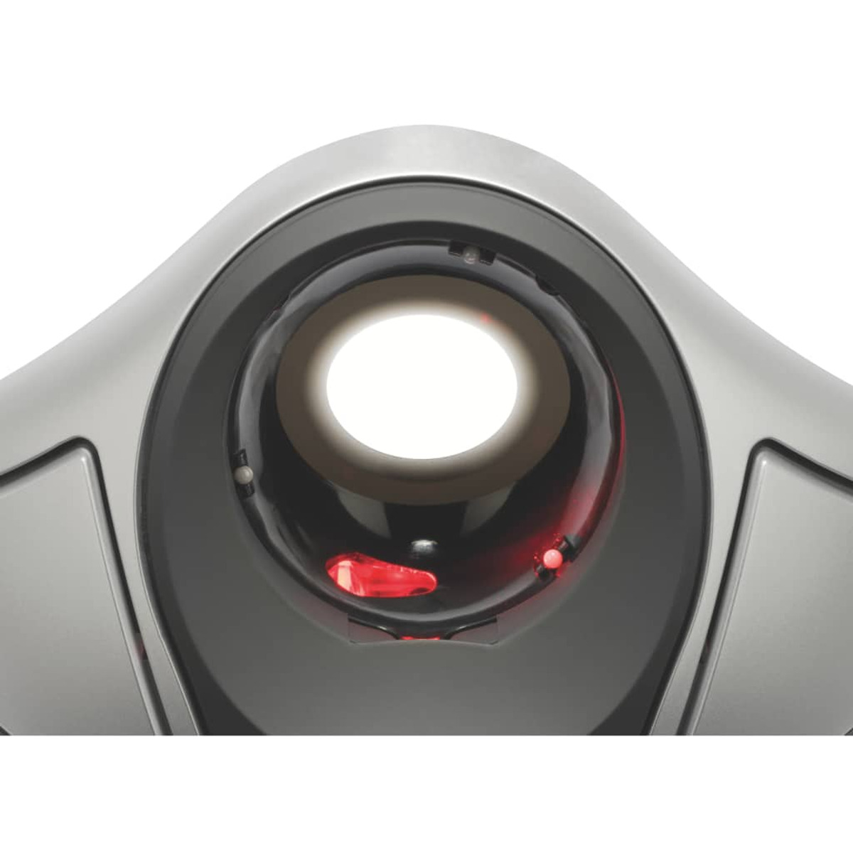 Close-up of a metallic device with a circular light and red dots, on a white background.