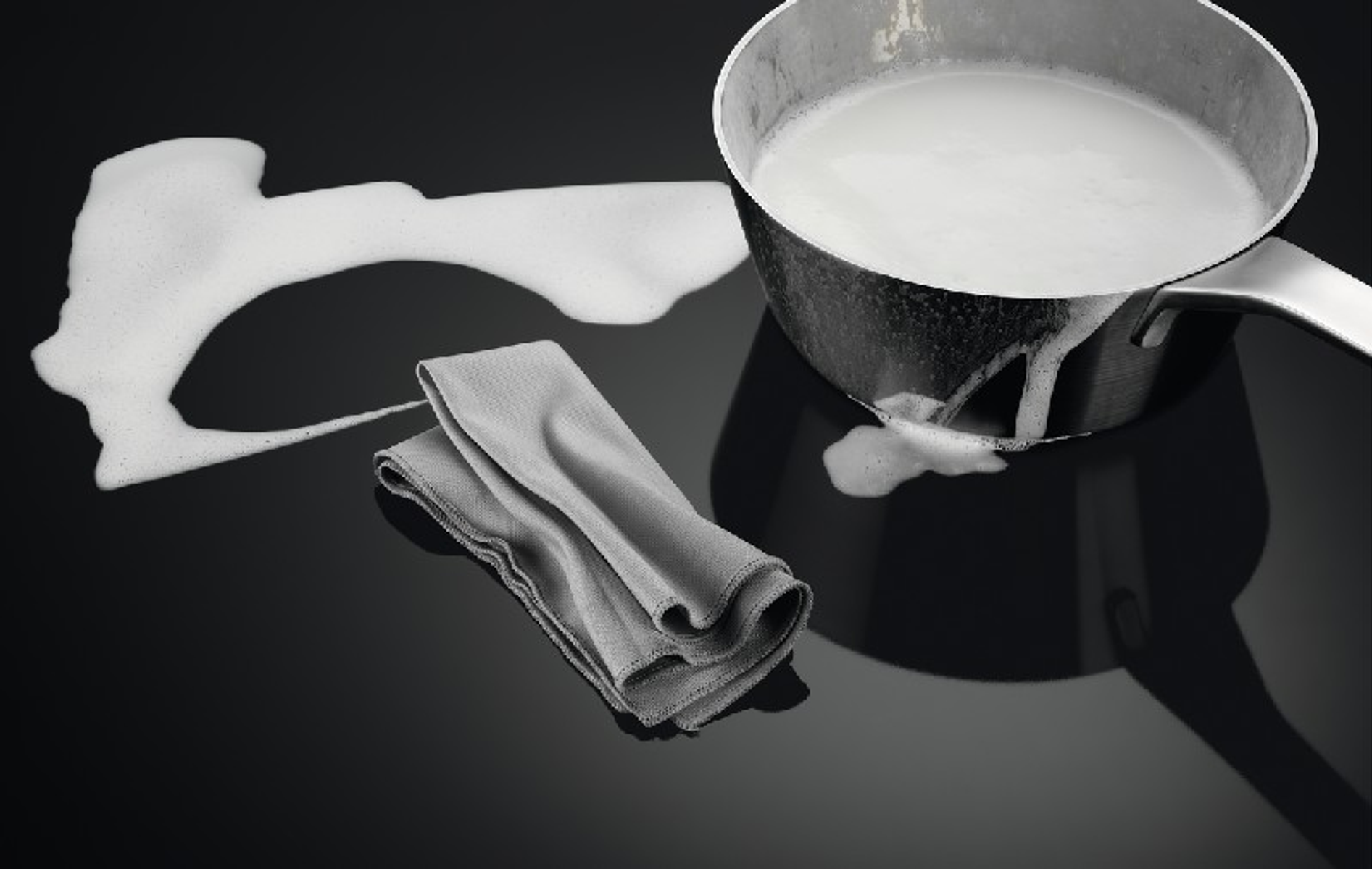 Leche desbordándose de una olla en una encimera negra, con un paño gris al lado.