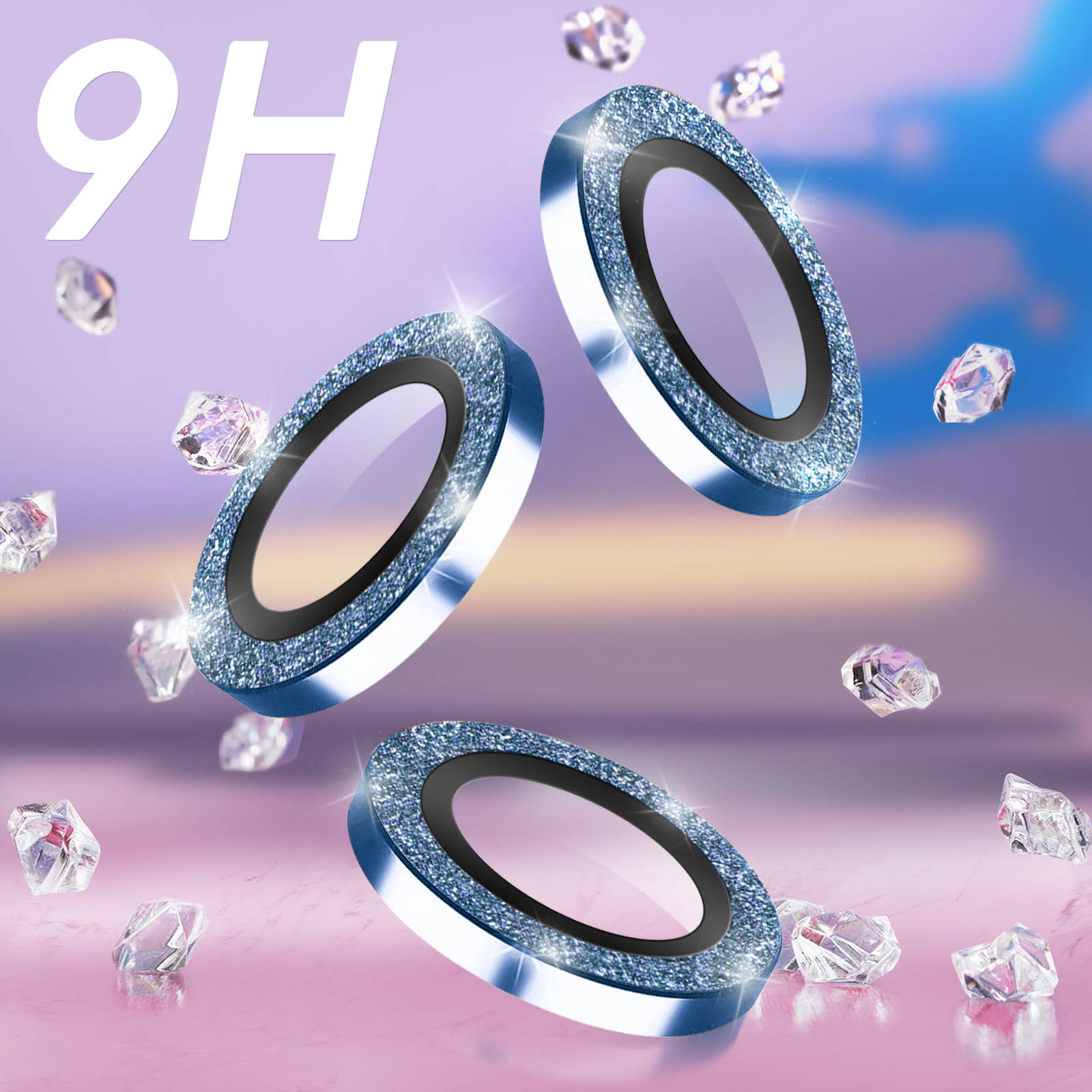 Tre protezioni per lenti del telefono blu con brillantini. Diamanti fluttuano su sfondo rosa.