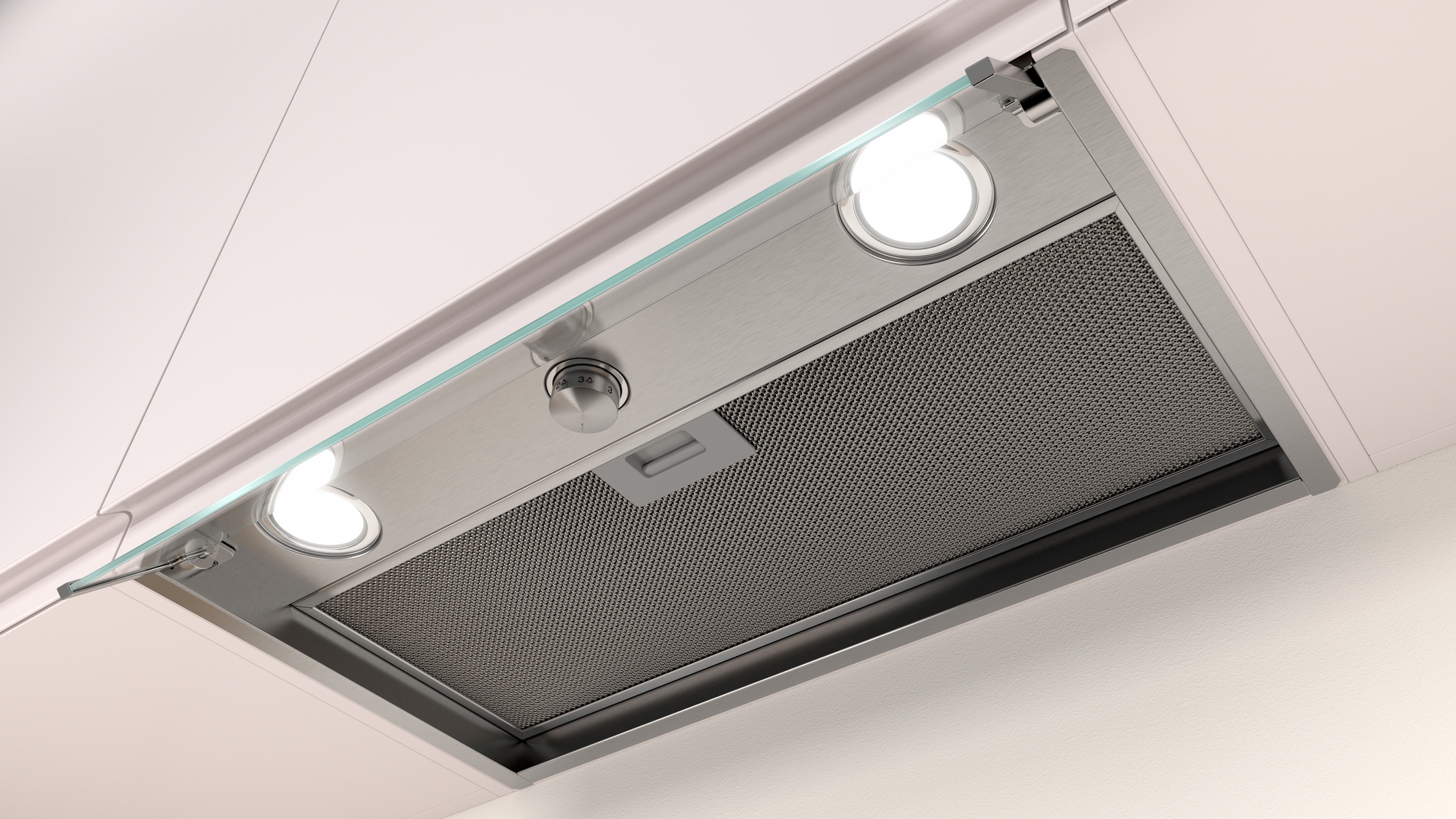 Primo piano dell'interno di una cappa, che mostra luci, un filtro e il funzionamento interno.