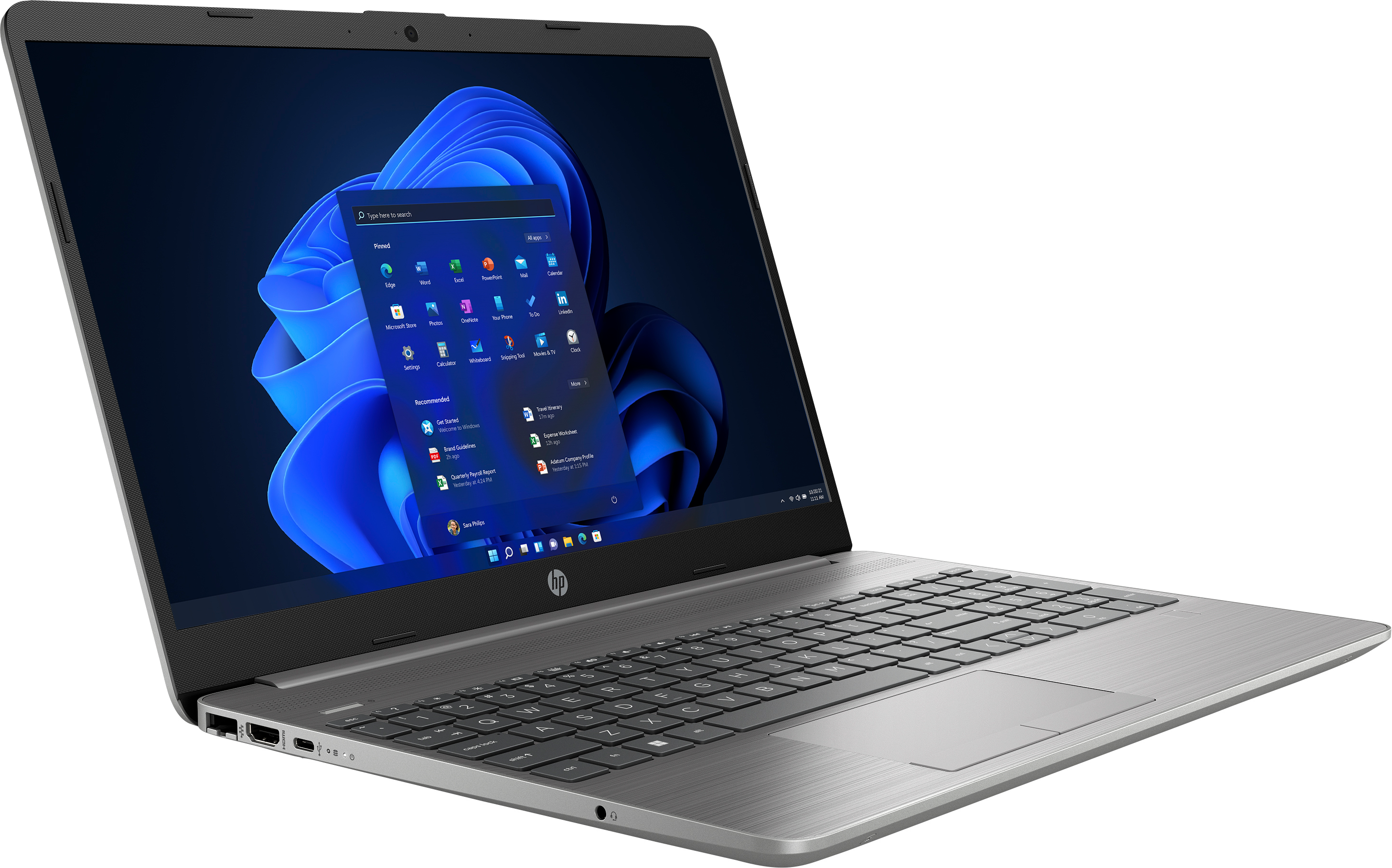 Ordenador portátil plateado abierto, mostrando la interfaz de Windows 11. La tapa y el teclado son visibles con fondo azul oscuro.