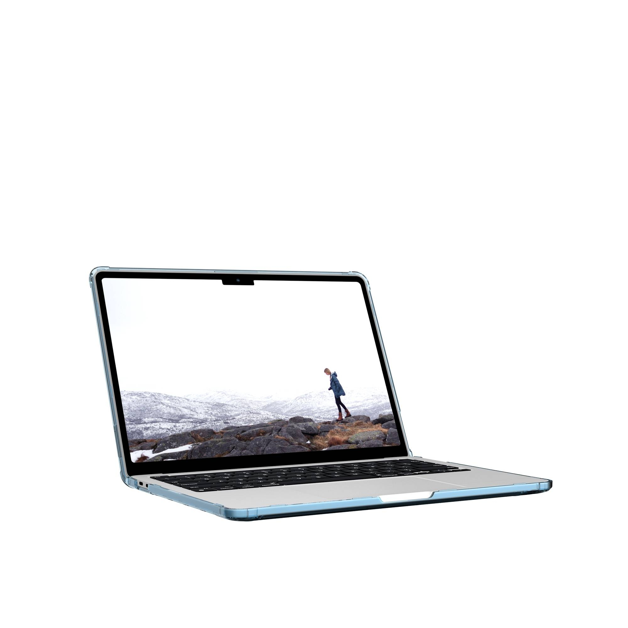 Laptop auf weißem Hintergrund, zeigt eine verschneite Landschaft mit einer Person, die geht.