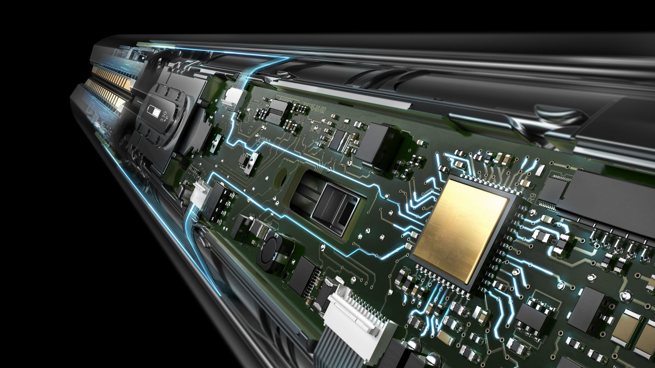 Zbliżenie płytki drukowanej, z wieloma komponentami i okablowaniem. Czarne tło.