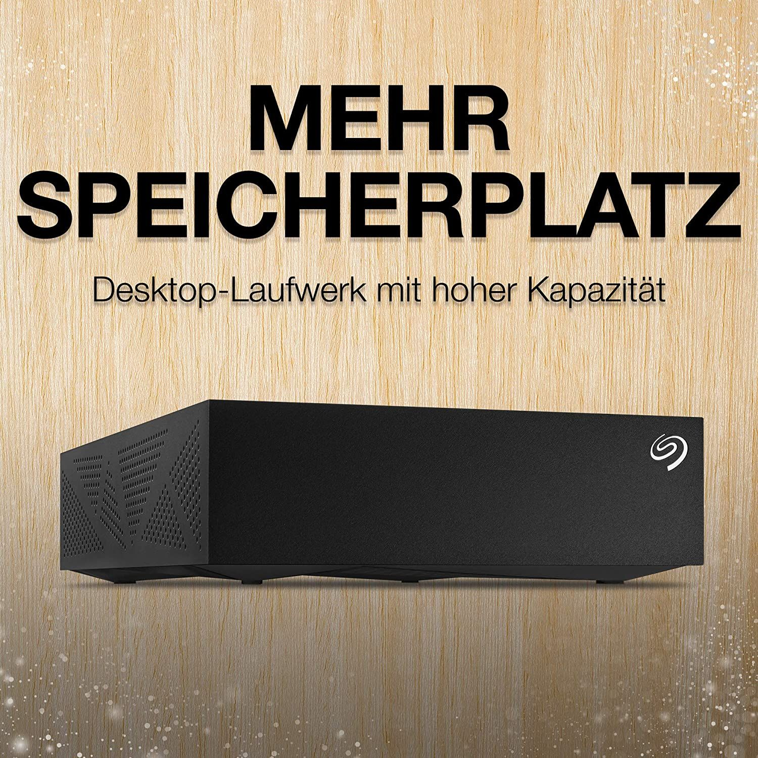 Schwarze externe Festplatte auf Holzoberfläche, darüber der Text 'MEHR SPEICHERPLATZ'.