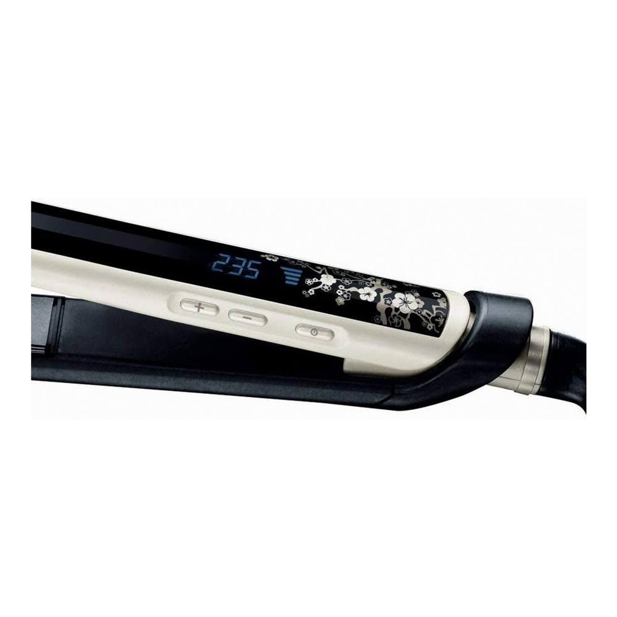 Primer plano de una plancha de pelo con diseño en blanco y negro y una pantalla que muestra 235.