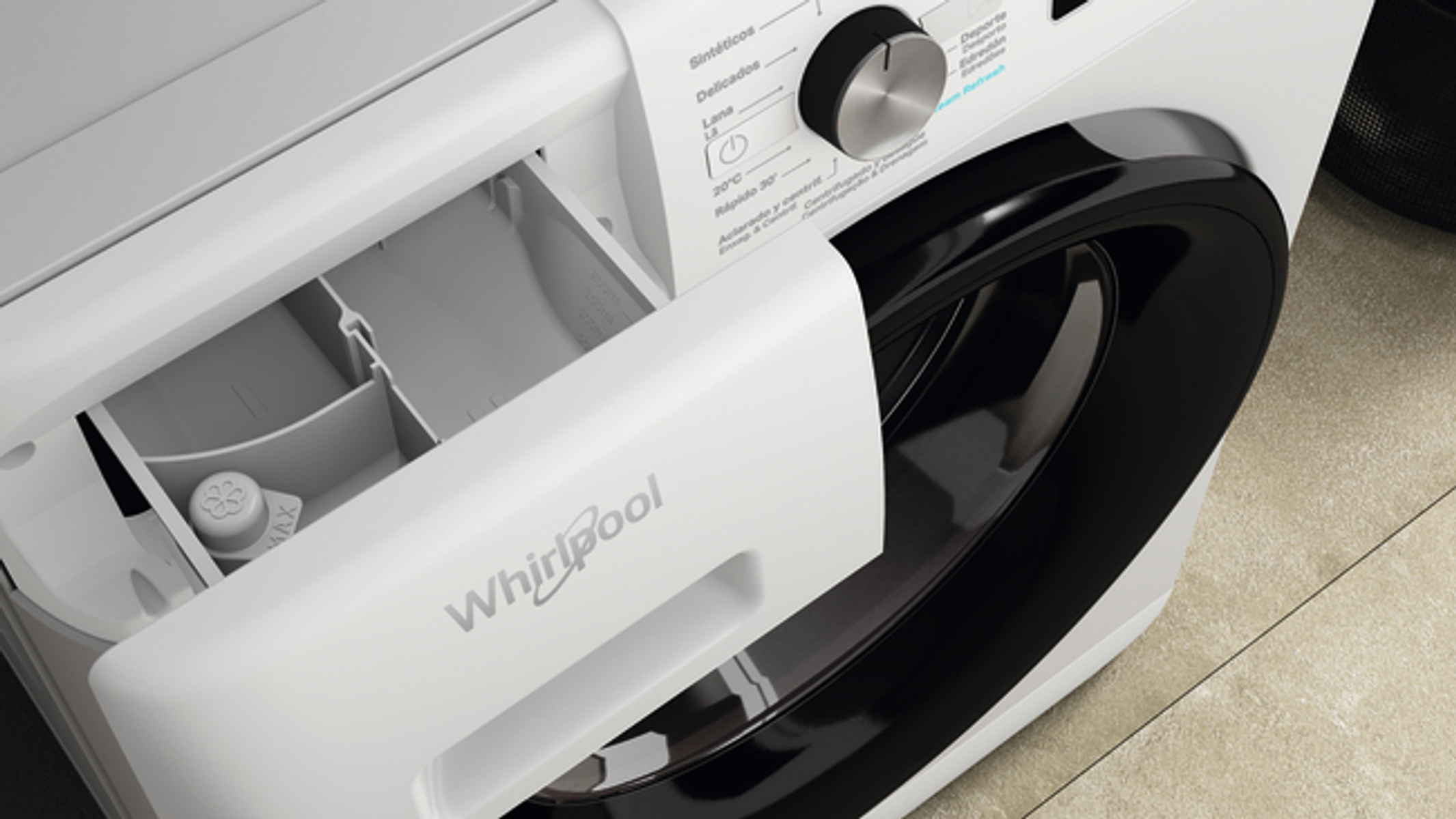 Lavadora blanca con cajón de detergente abierto. Logotipo de Whirlpool visible.