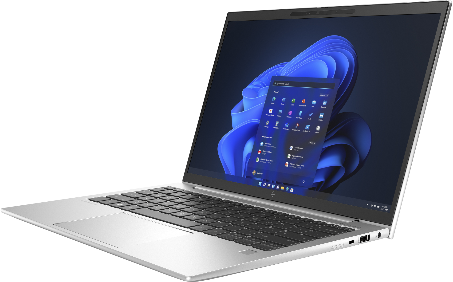 Portátil plateado con pantalla iluminada que muestra iconos de aplicaciones. Teclado y panel táctil visibles.