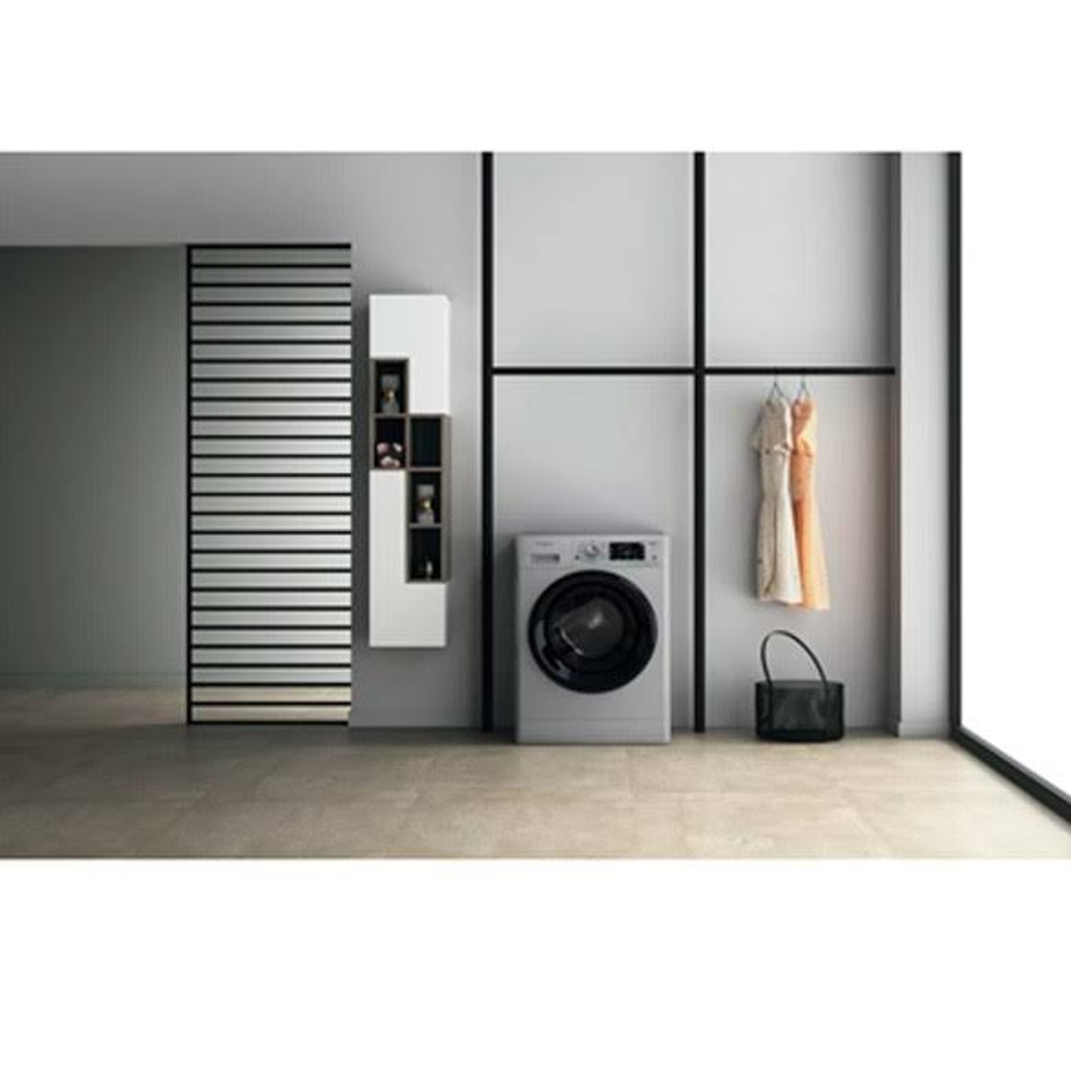 Un lavadero moderno con lavadora, ropa y elementos decorativos.
