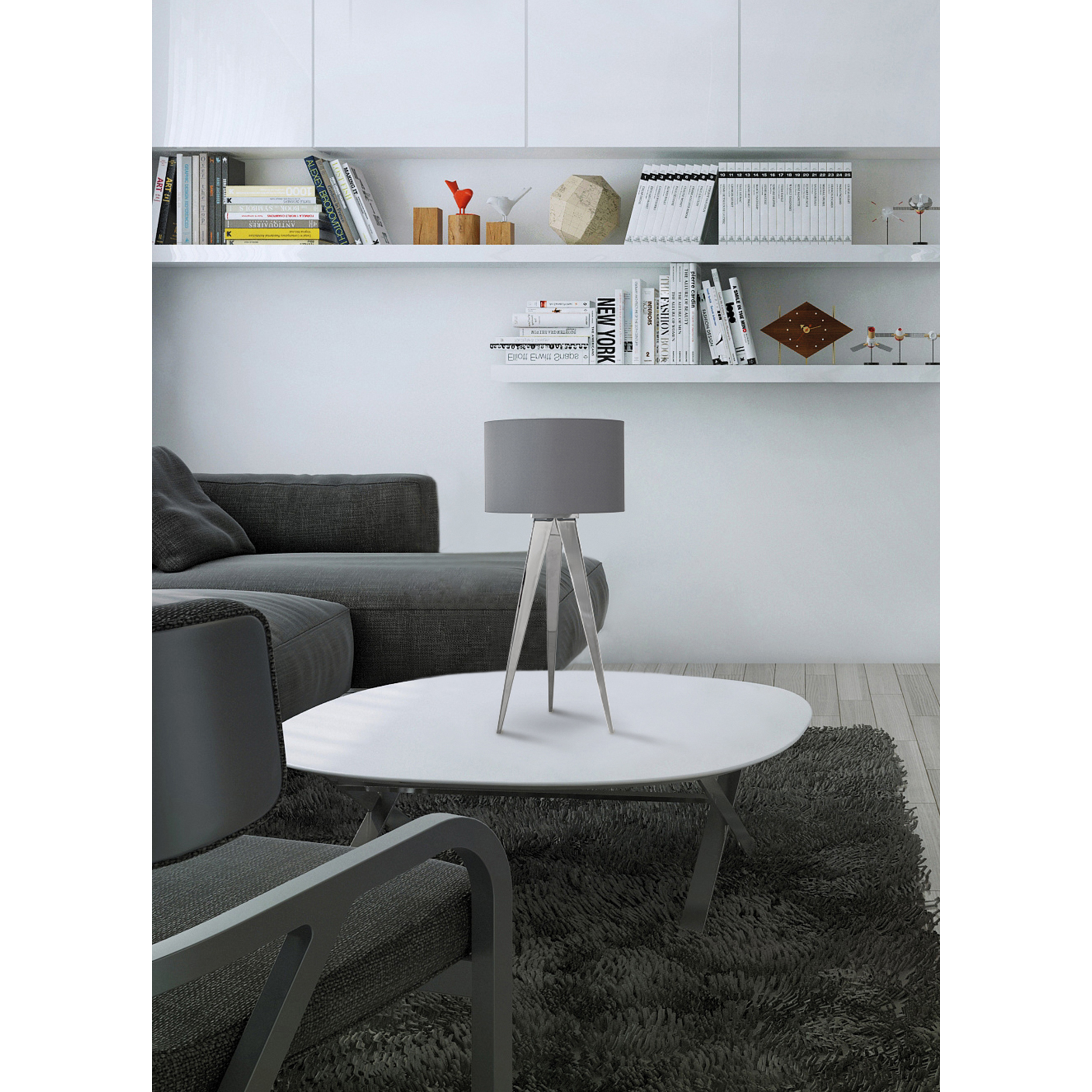 Wohnzimmerszene mit weißem Tisch, grauer Lampe und grauem Sofa.