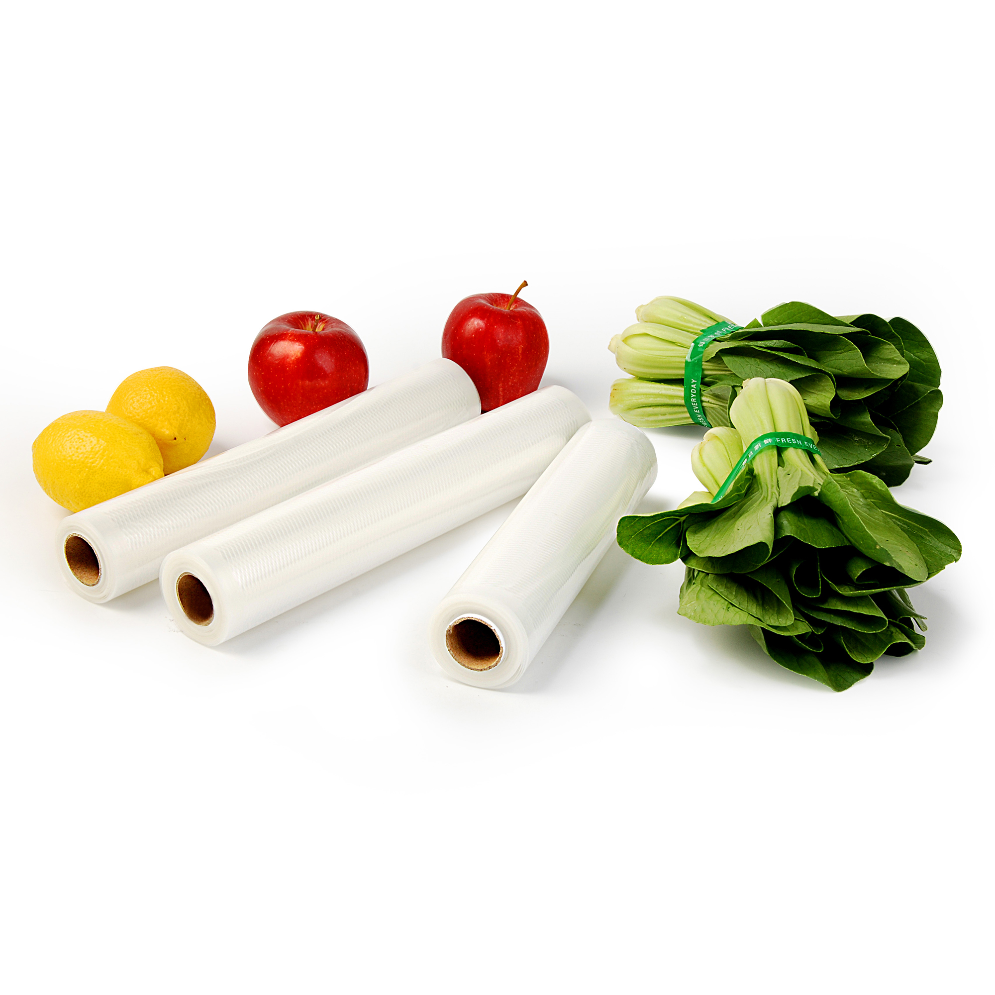 Owoce i warzywa, w tym jabłka, cytryny i rolki do zgrzewania próżniowego.
