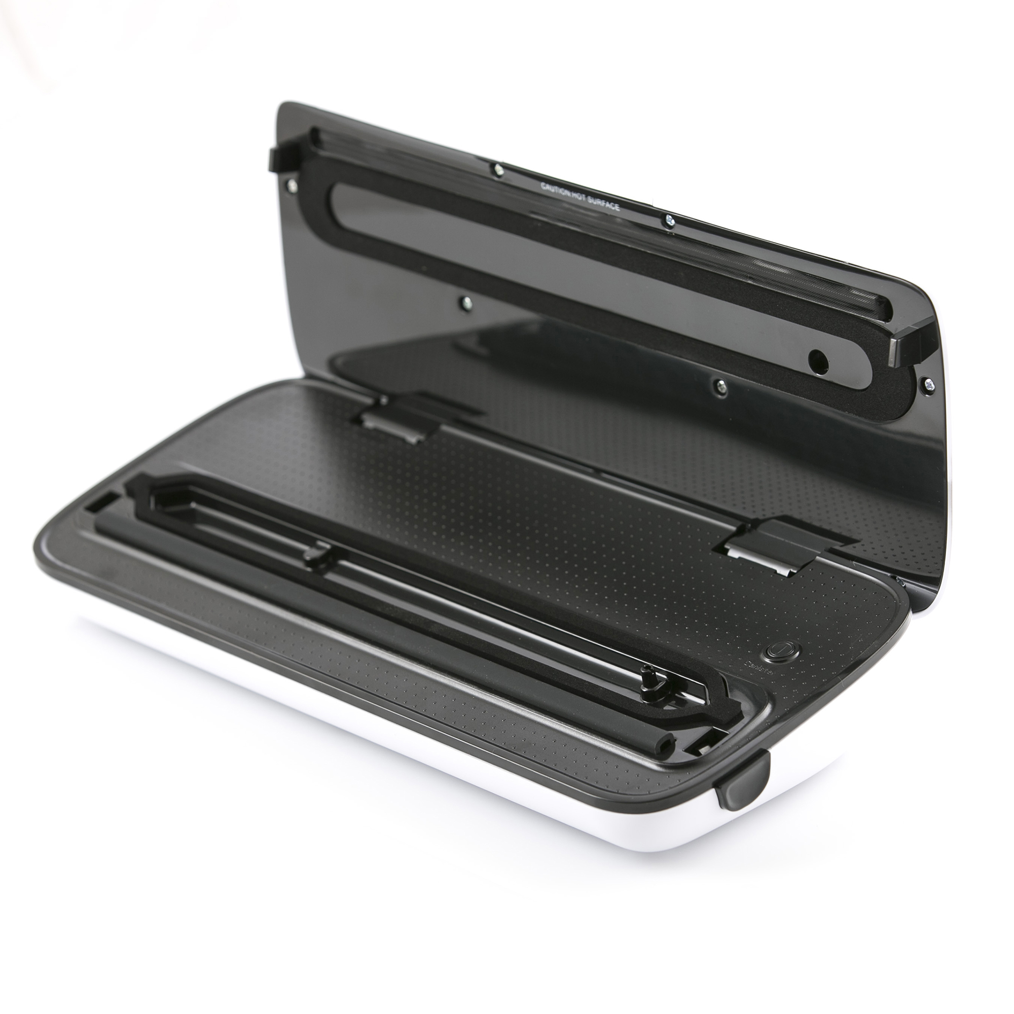 Biało-czarna zgrzewarka próżniowa, otwarta. Pokrywa uniesiona, ukazująca wnętrze.