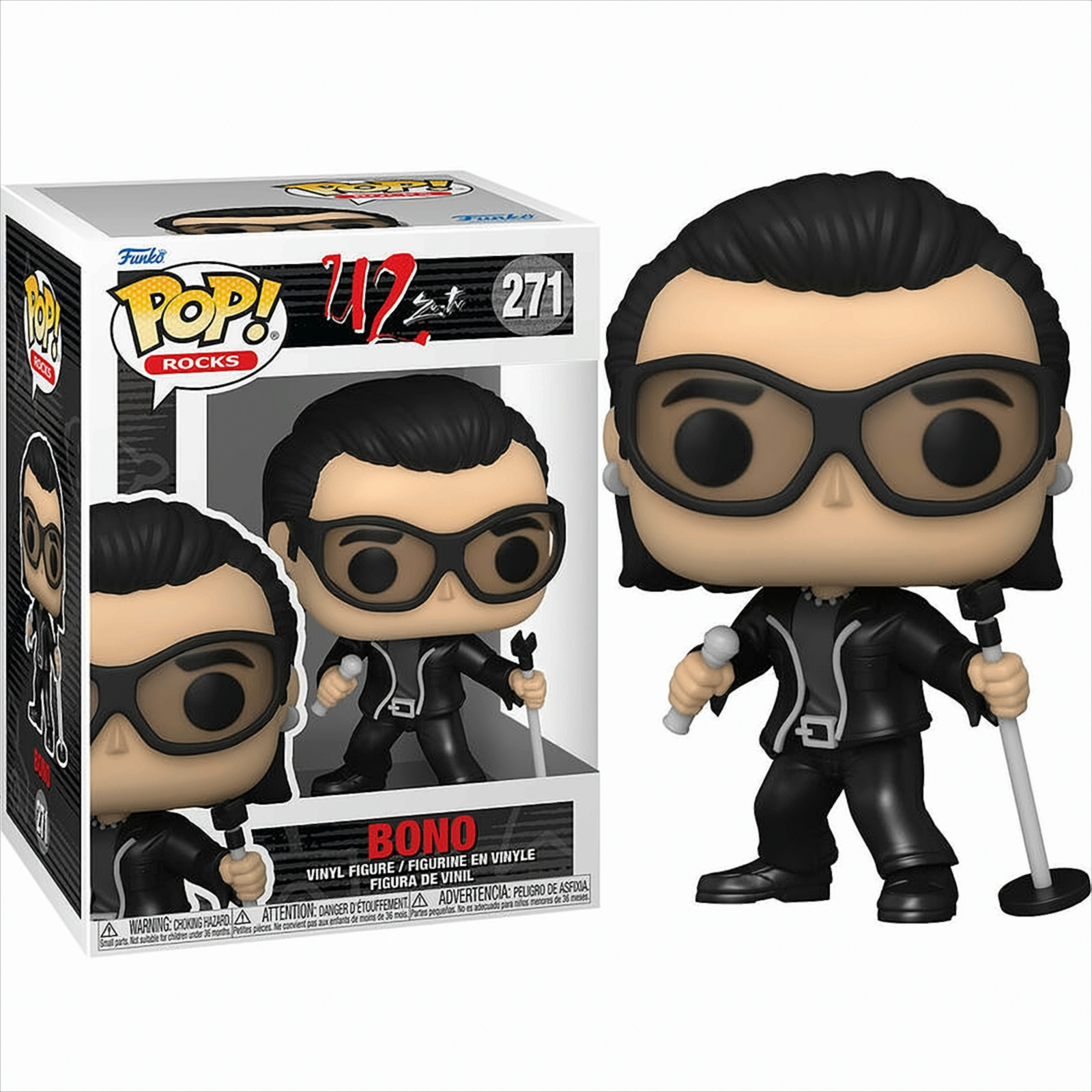 U2 Bono Figur, schwarzer Anzug, Brille, hält Mikrofon. Box links. Weißer Hintergrund.