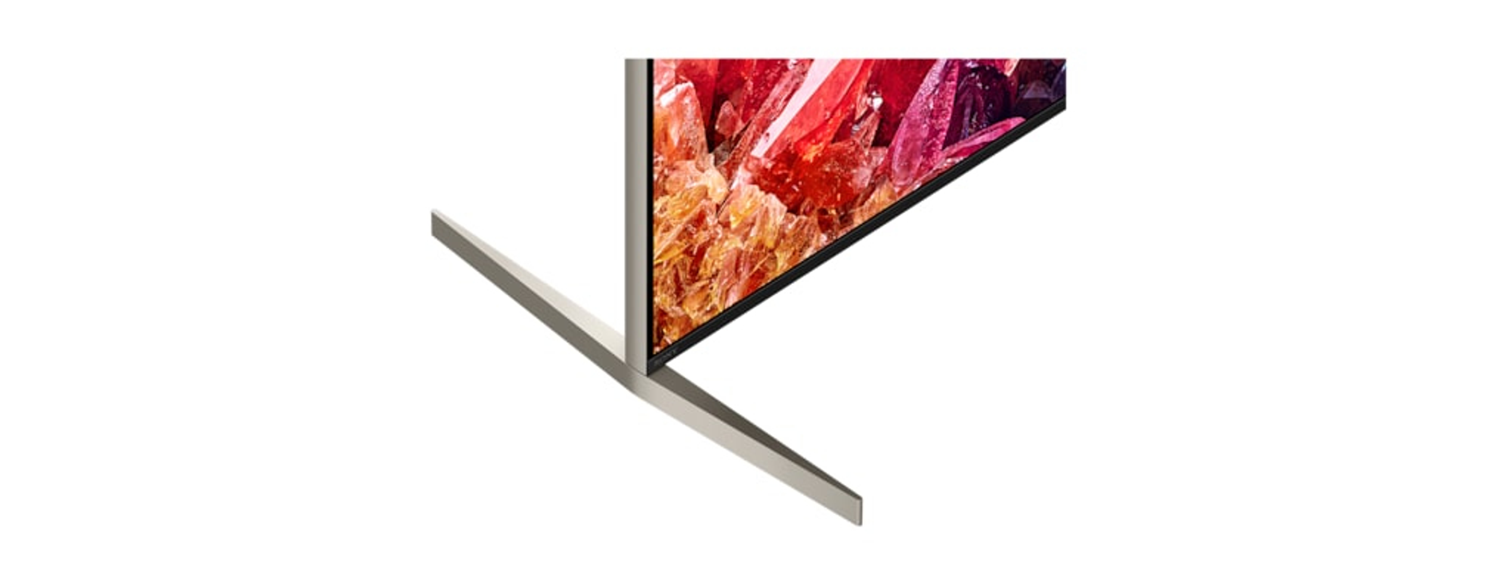 Un primo piano di un supporto TV, che mostra il bordo di uno schermo con un'immagine colorata.