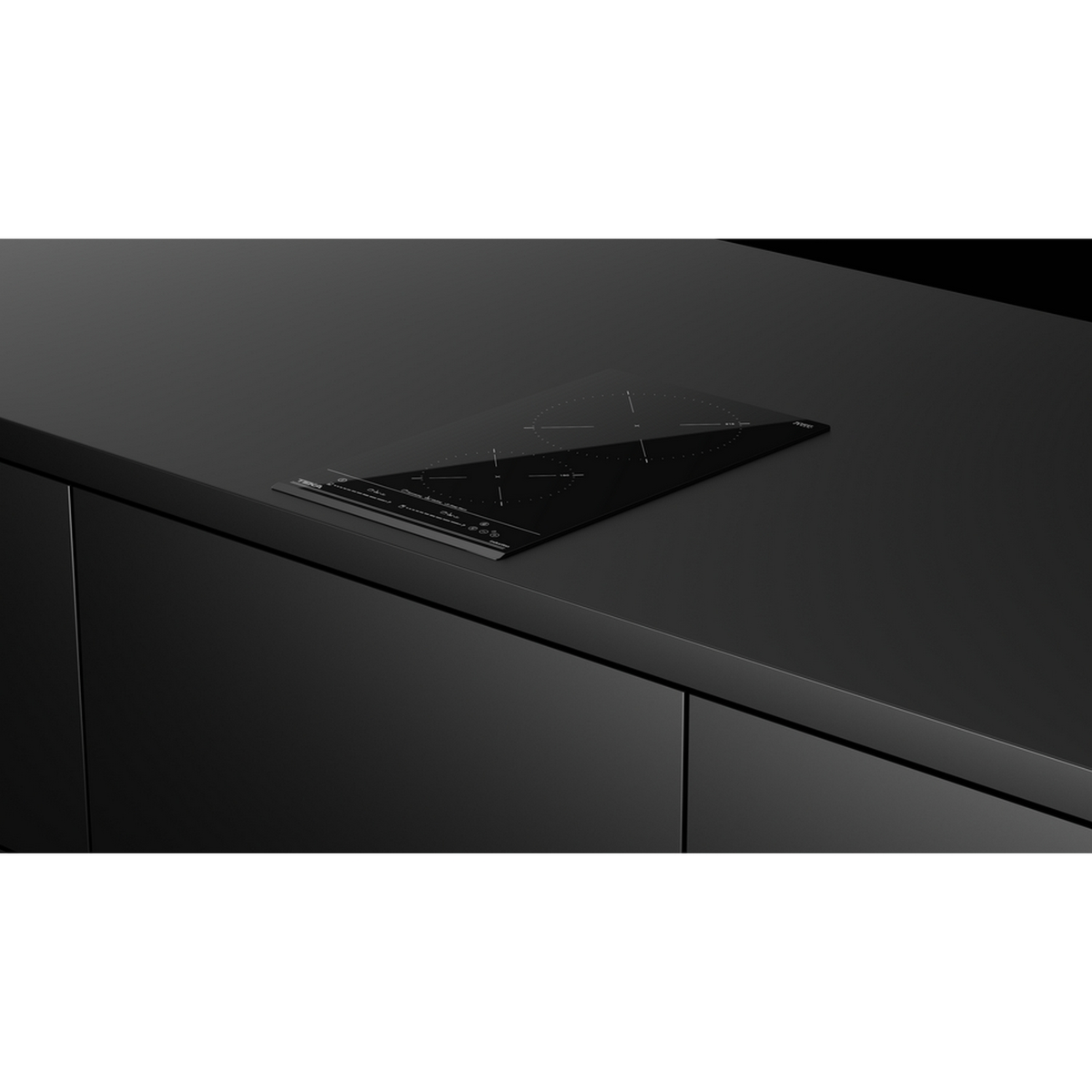 Czarna, wbudowana płyta grzejna z elementami sterowania dotykowego na czarnym blacie.