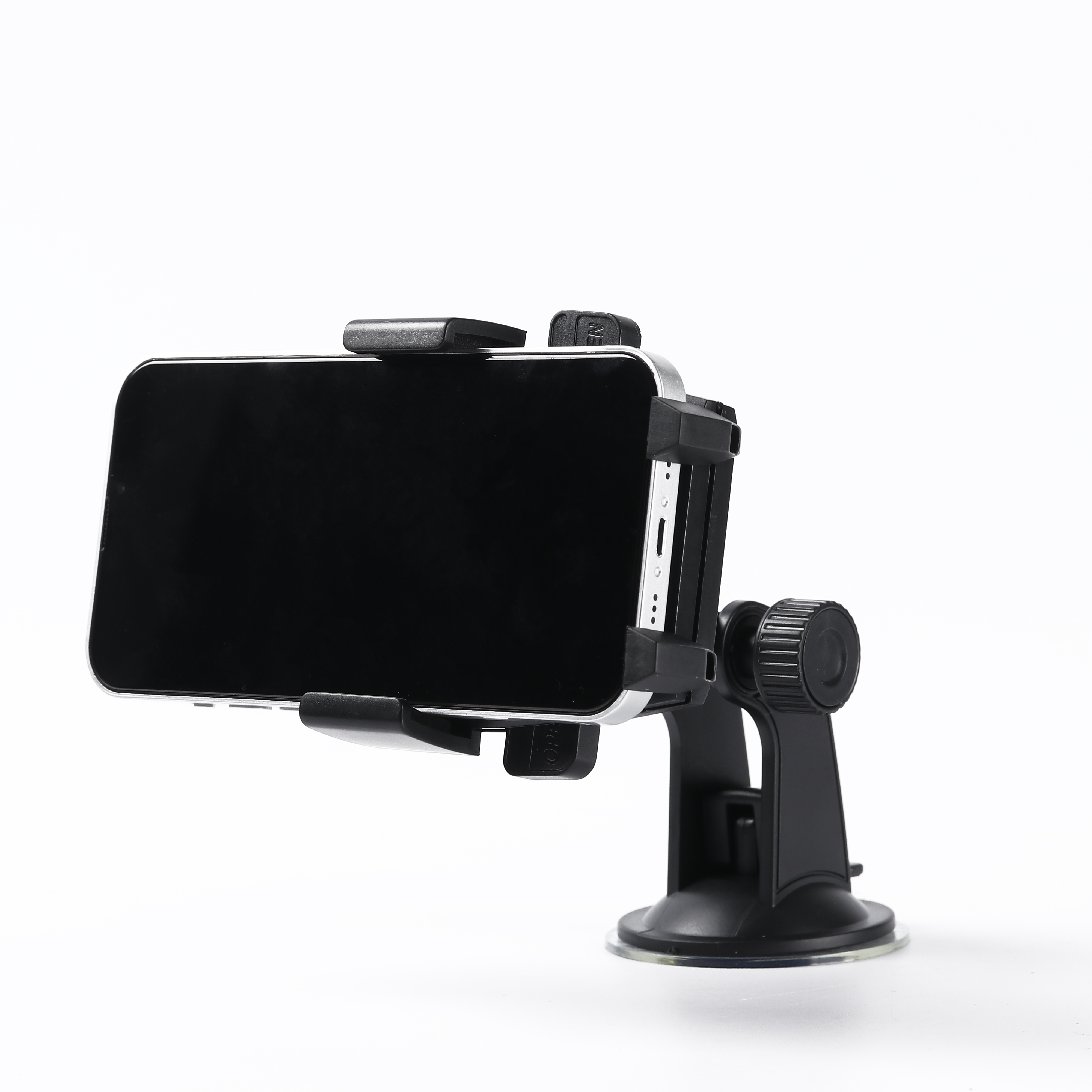 Uchwyt samochodowy na telefon, czarny, z zamontowanym telefonem. Podstawa z przyssawką.