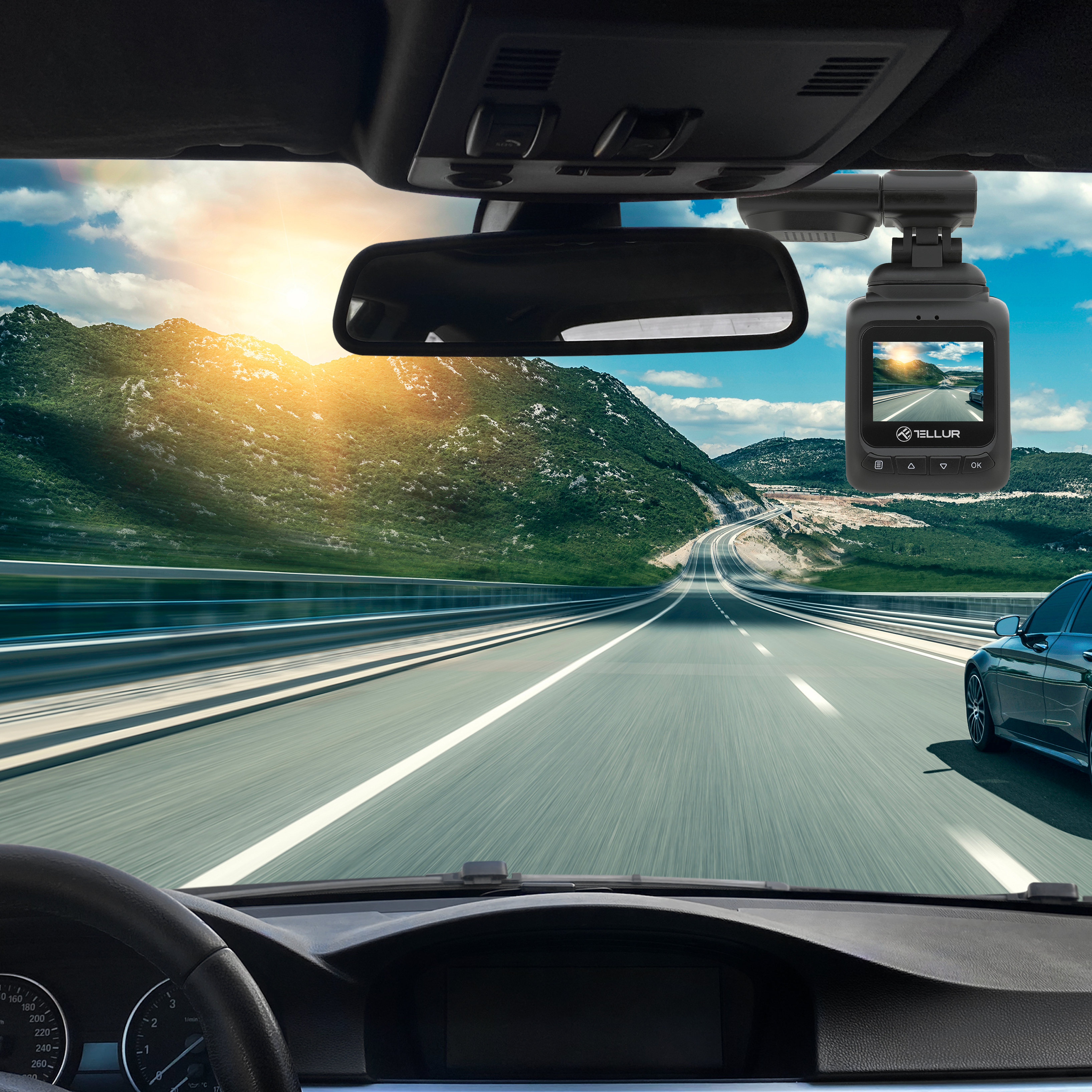 Kamera samochodowa zamontowana w samochodzie. Pokazuje drogę i malownicze tło.
