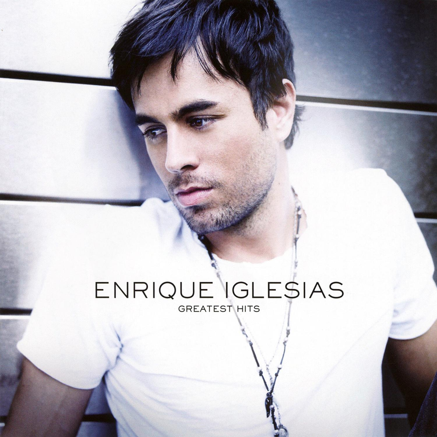 Enrique Iglesias Albumcover. Mann im weißen Hemd, der wegschaut, Text 'ENRIQUE IGLESIAS Greatest Hits'.