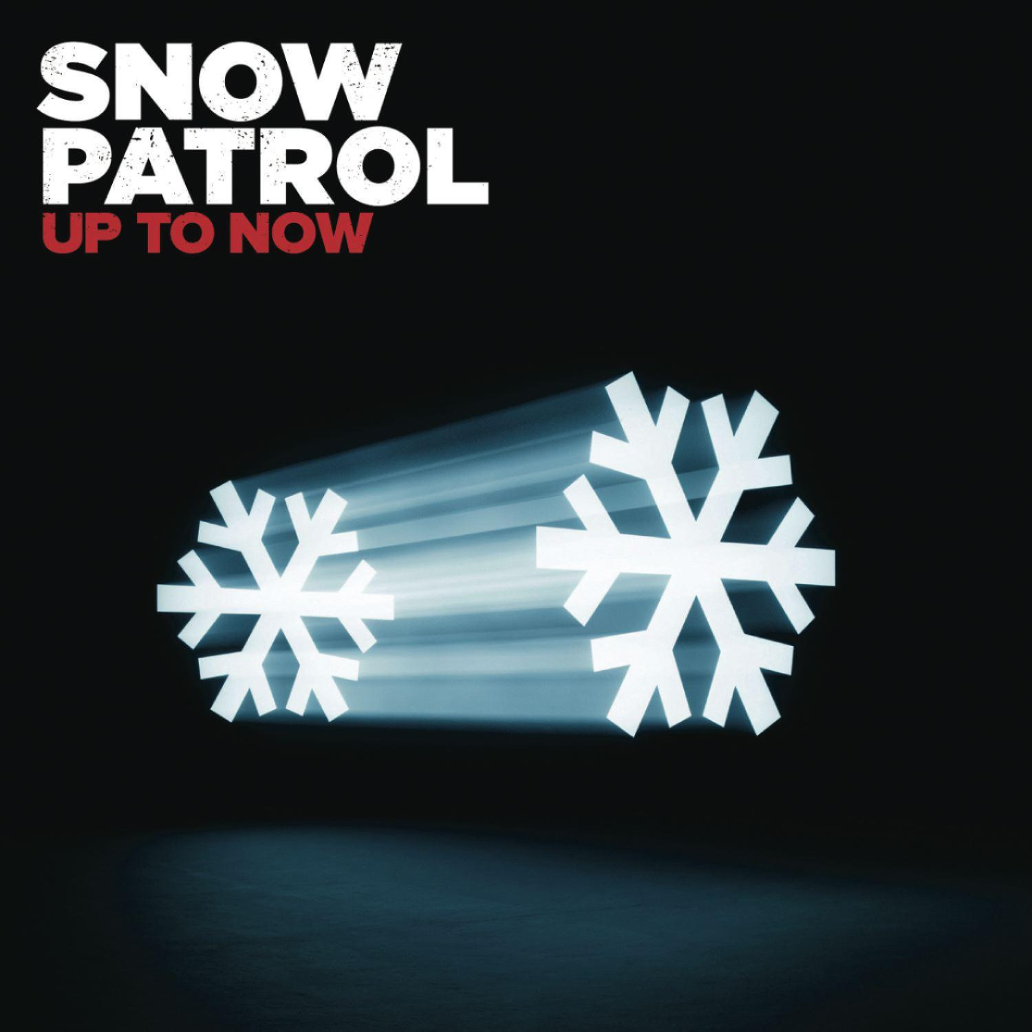 Deux flocons de neige blancs avec des traînées lumineuses sur fond noir. Texte 'SNOW PATROL' et 'UP TO NOW'.