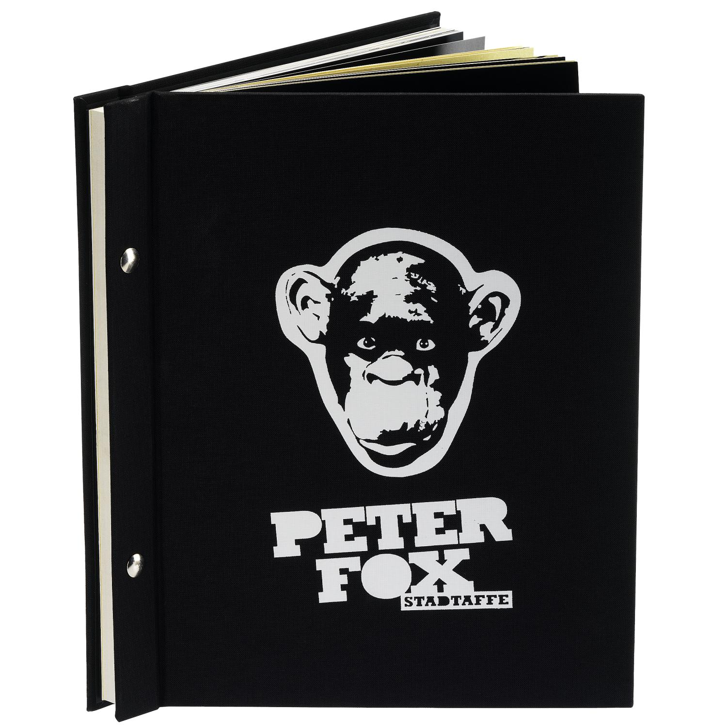 Schwarzes Buch mit Affenkopf und Schriftzug PETER FOX STADTTAFFE