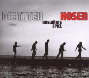 Ein CD-Cover mit der Band Die Toten Hosen, Silhouetten von Leuten, die auf einem Pier gehen.