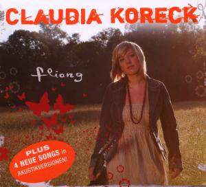 Albumcover von Claudia Koreck. Eine Frau steht auf einem Feld. Schmetterlinge und Text sind sichtbar.