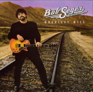 Albumcover mit Bob Seger, der Gitarre hält. Bahngleise und Berge im Hintergrund.